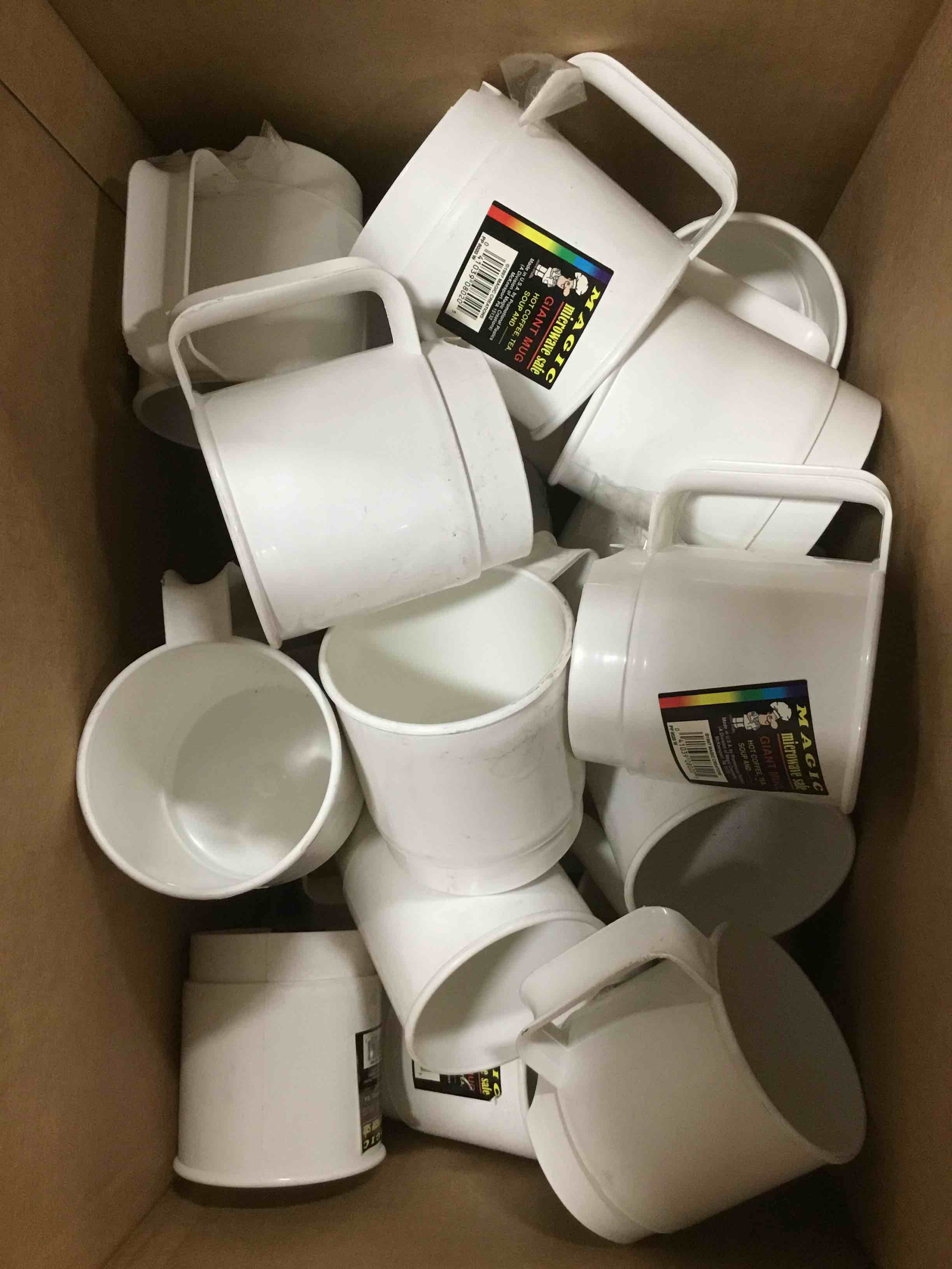 Box with white plastic cups for coffee 