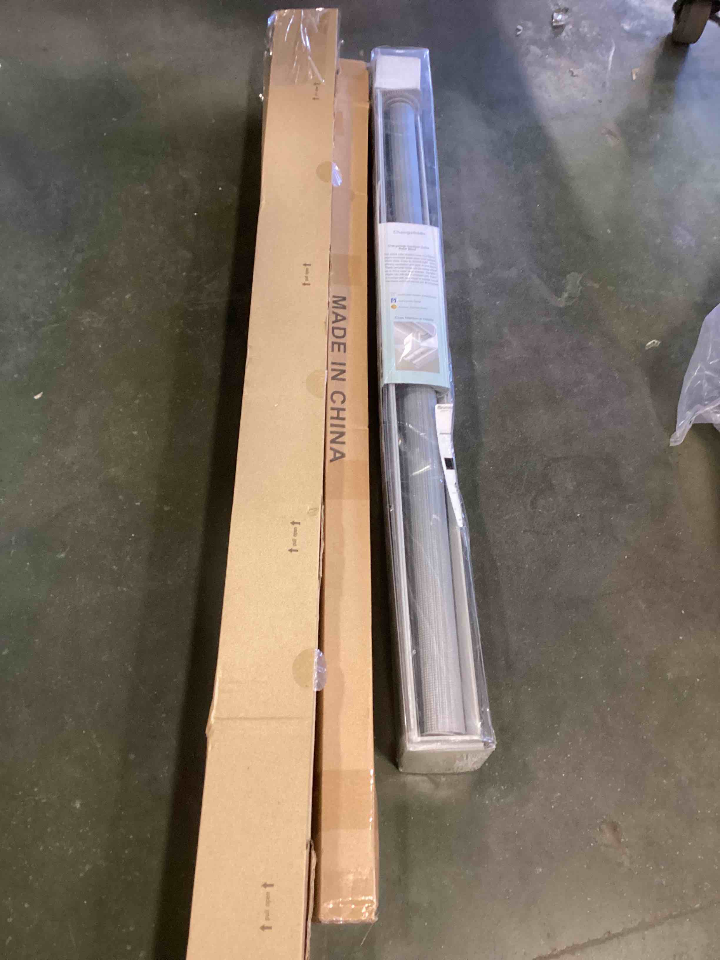 Assorted household items: curtain rods and roller shade 