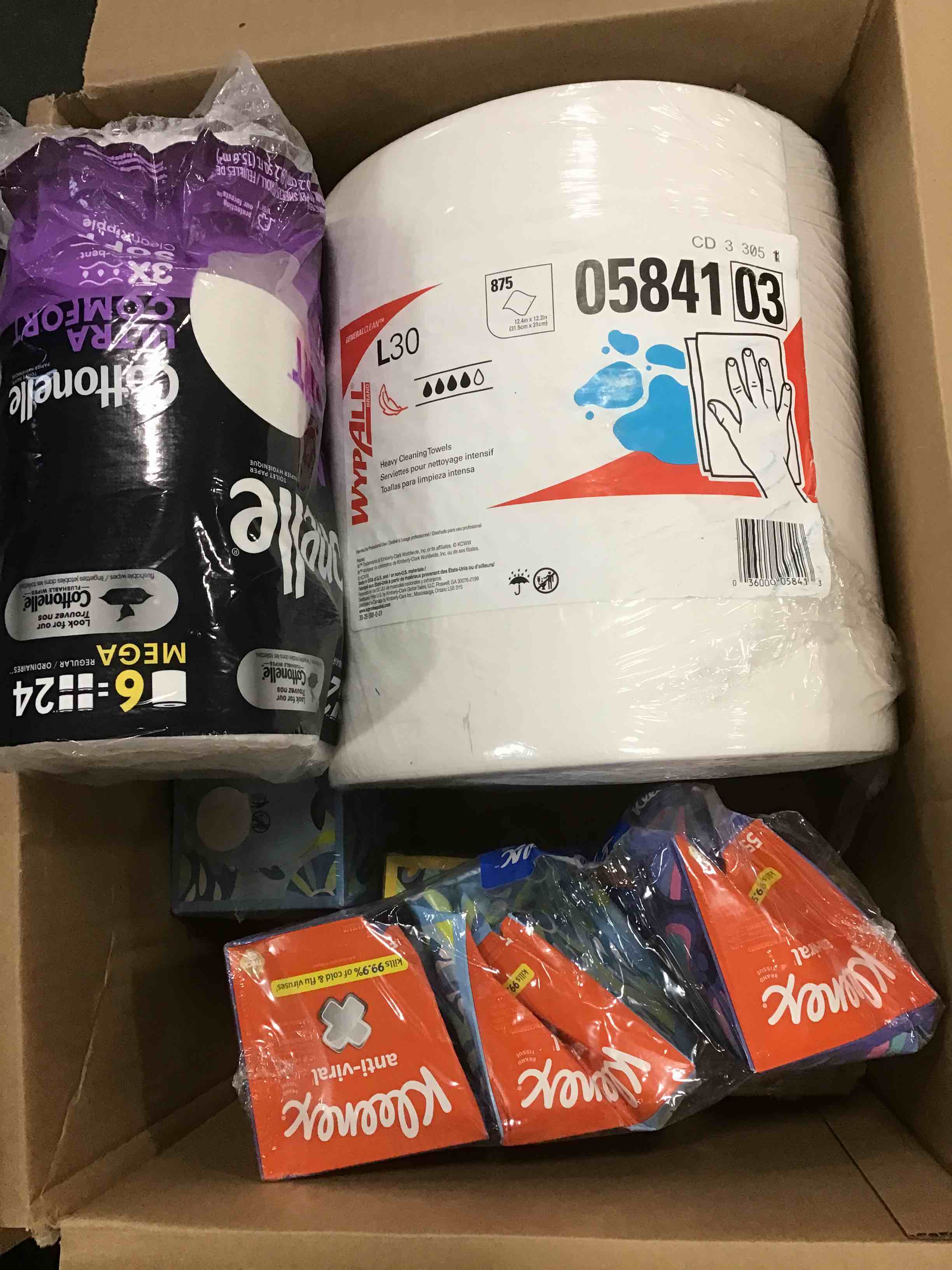 Assorted bathrooms products: Kleenex, toilet paper rolls and more 