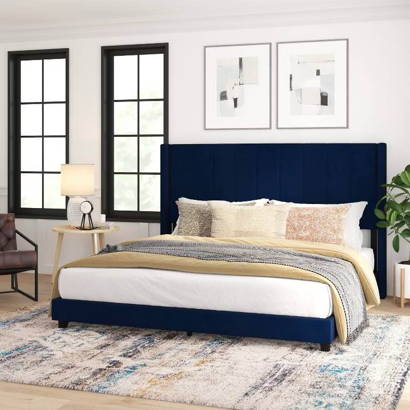 navy blue platform bed with wing back headboard