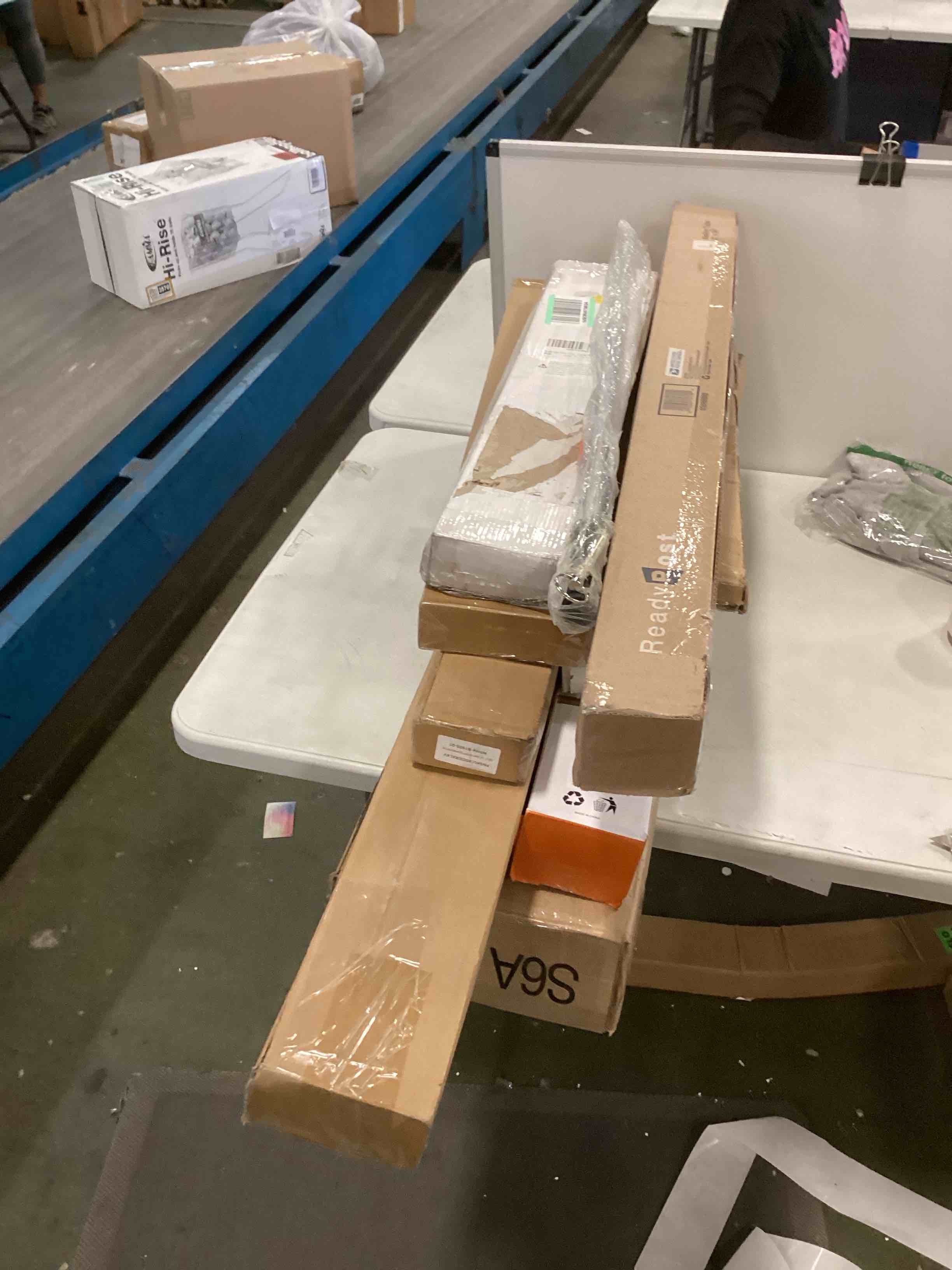 assorted miscellaneous items include of curtain rods,cordless baby gate and more