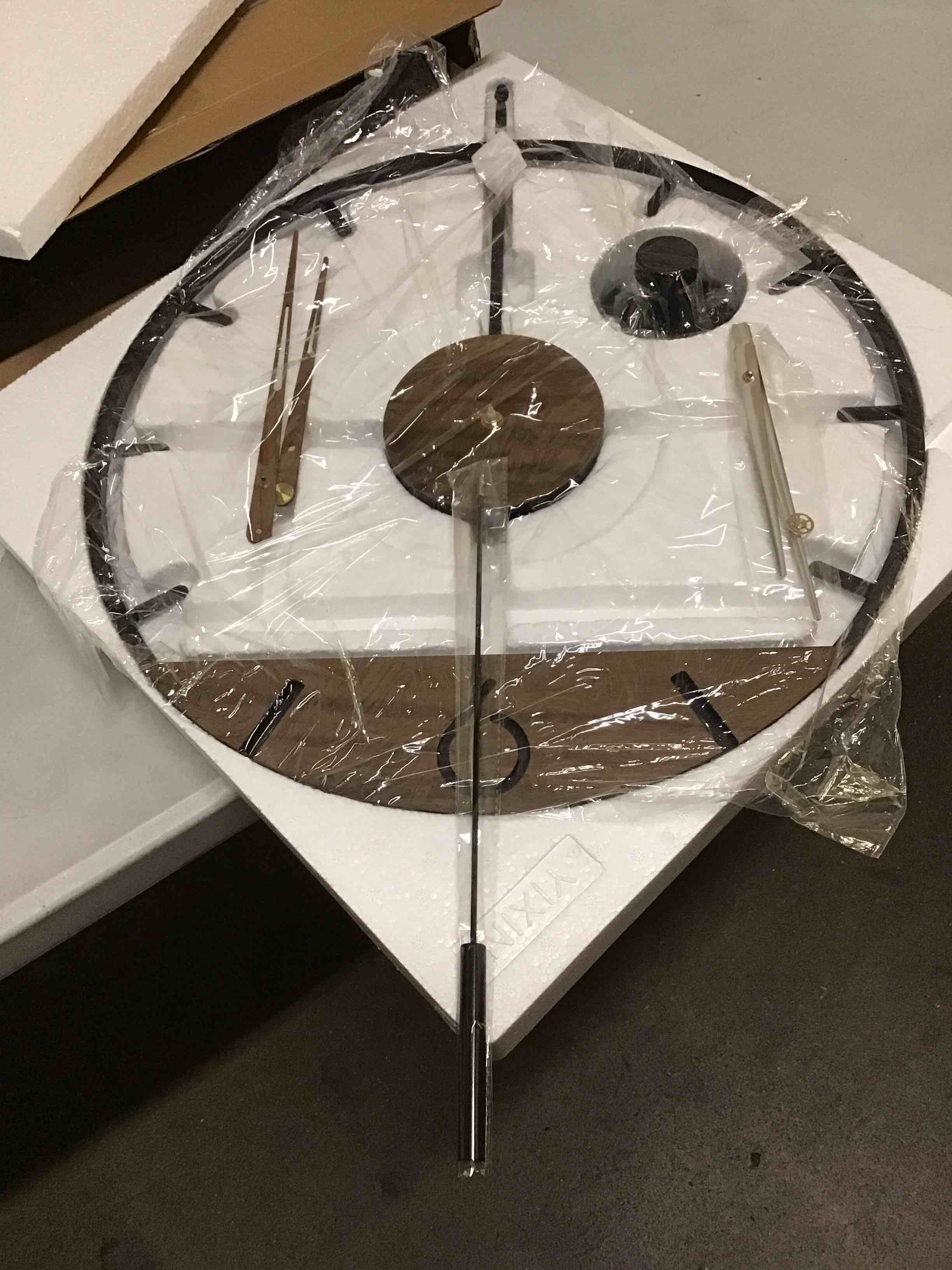 Condition photo showing New/Like New for 30.7×20 Inch Large Modern Decorative Pendulum Wall Clock,Big Metal Farmhouse Oversized Silent Wall Clocks Minimalist Elegant Walnut Dial Pointers for Living Room,Office,Dining Room Decor Black 30.7×20 Inch