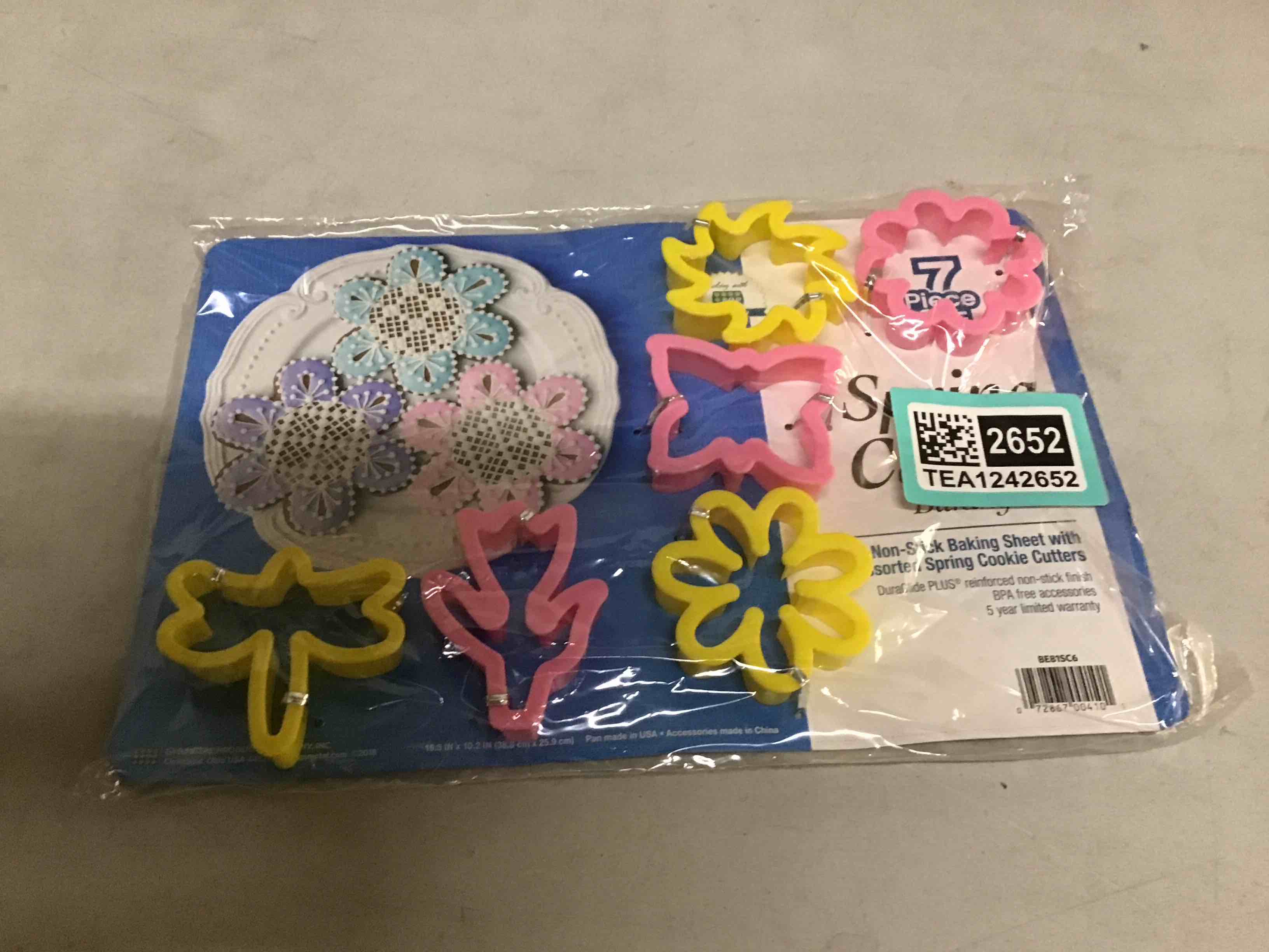 Condition photo showing As Is for Baking set 7 Pc. Set Spring Cookie Sheet with Assorted Spring Flowers Cookie Cutters Butterfly Tulip Daisy Zinnia Pinwheel Dragonfly Easter Flowers Bakeware
