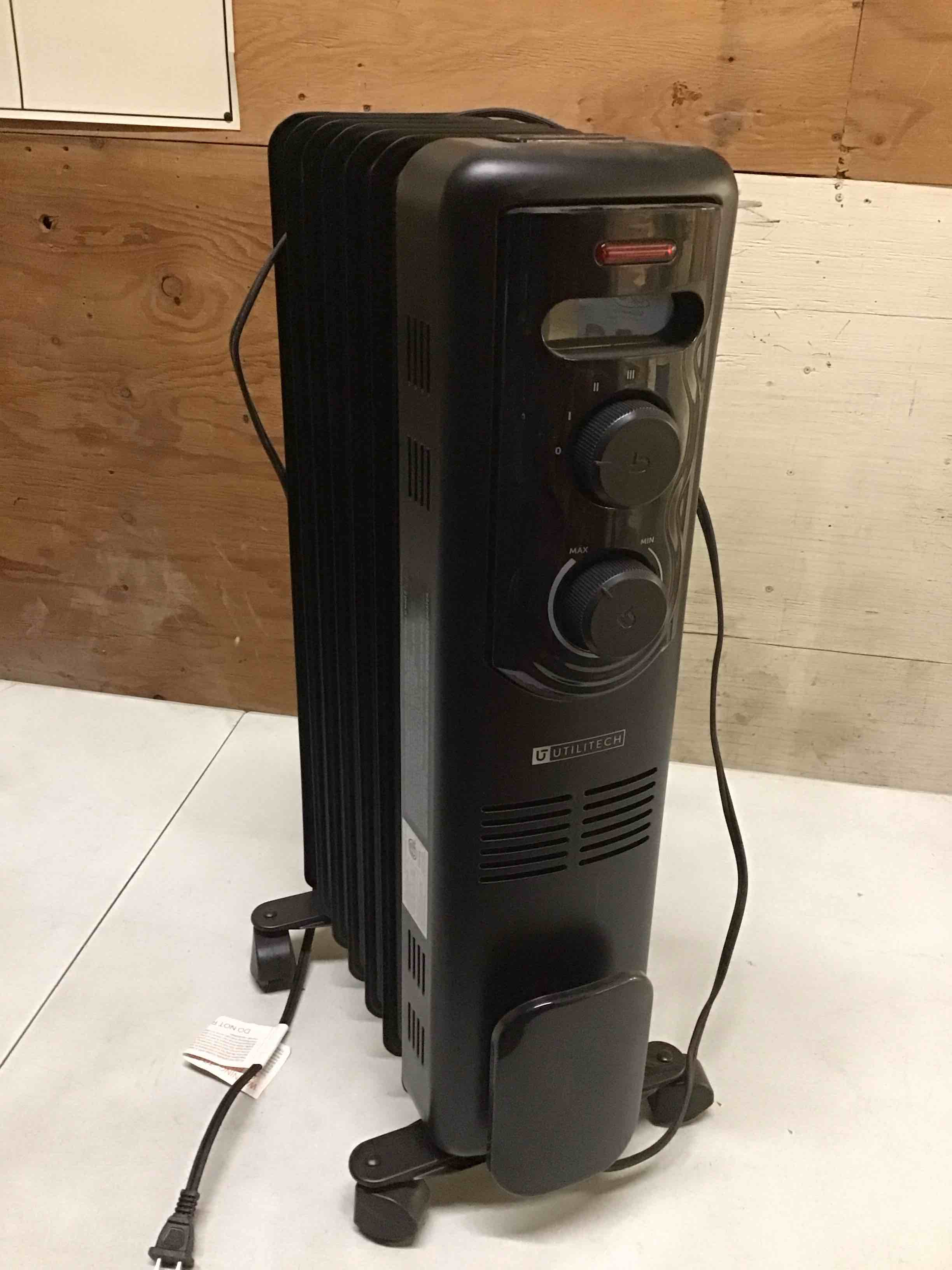 Condition photo showing As Is for Utilitech 1500 -Watt Oil-filled radiant Utility Indoor Electric Space Heater with Thermostat