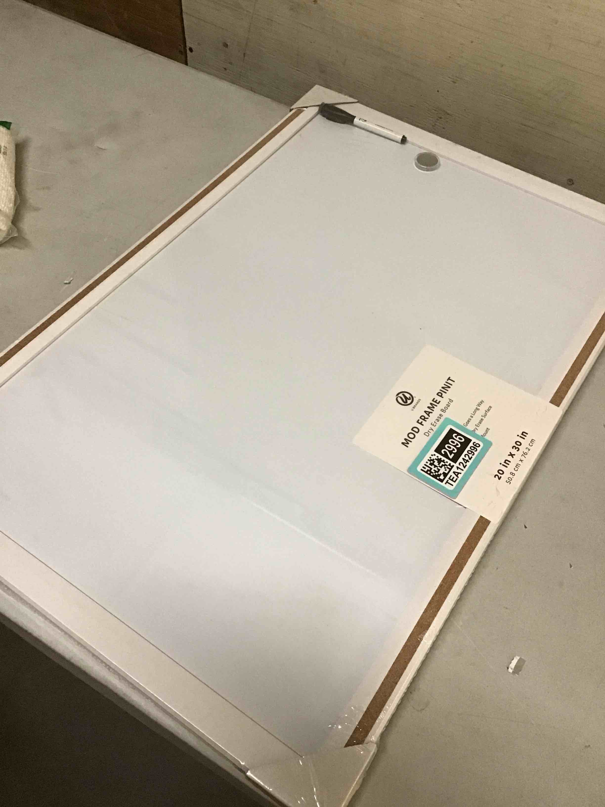 Condition photo showing As Is for ( with dent ) u brands magnetic dry erase board white board, 30" x 20", modern white wood style pin-it frame, includes marker and magnet