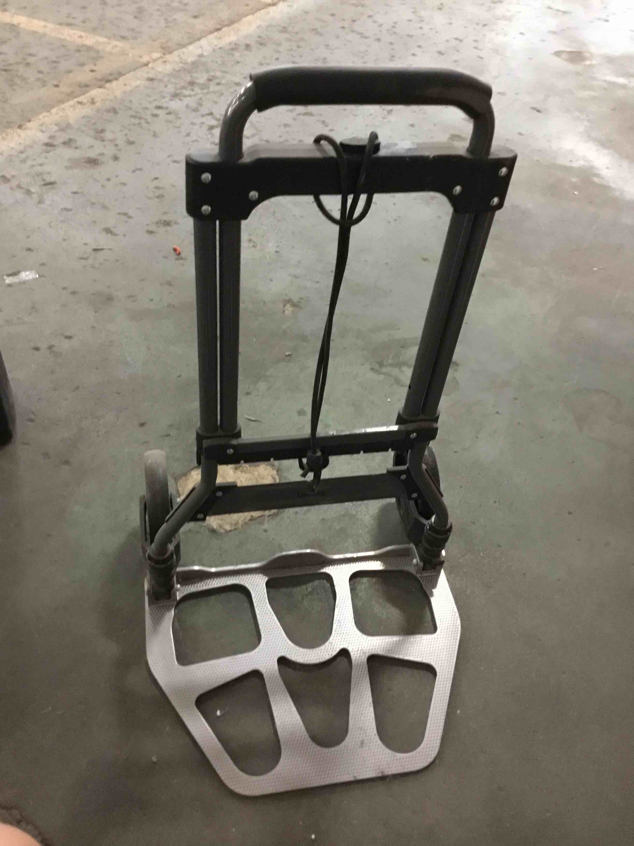 Condition photo showing As Is for 170 lb. capacity 2 wheel hand truck - lightweight aluminum & steel folding dolly