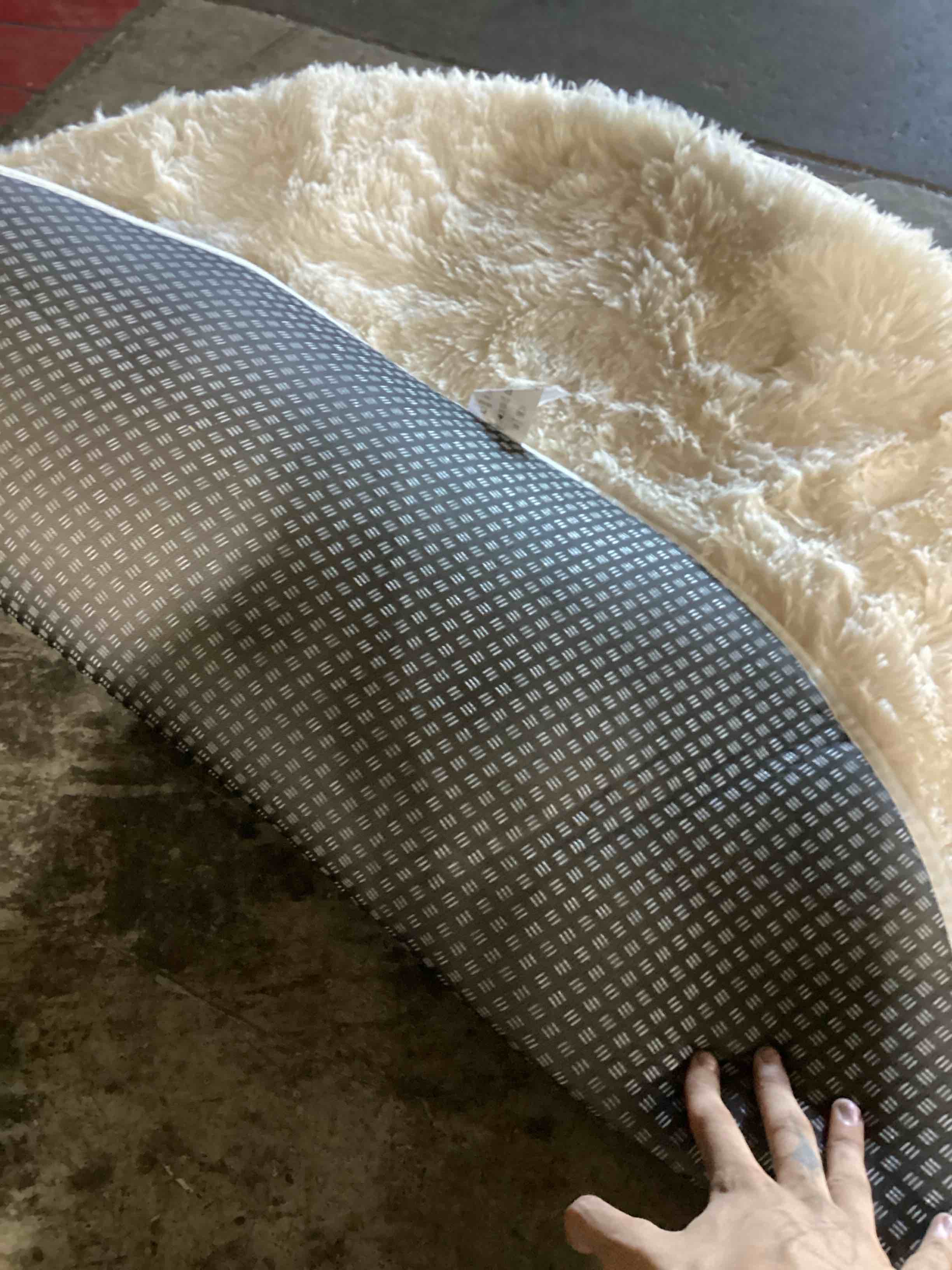 Condition photo showing As Is for slight stain circle rug