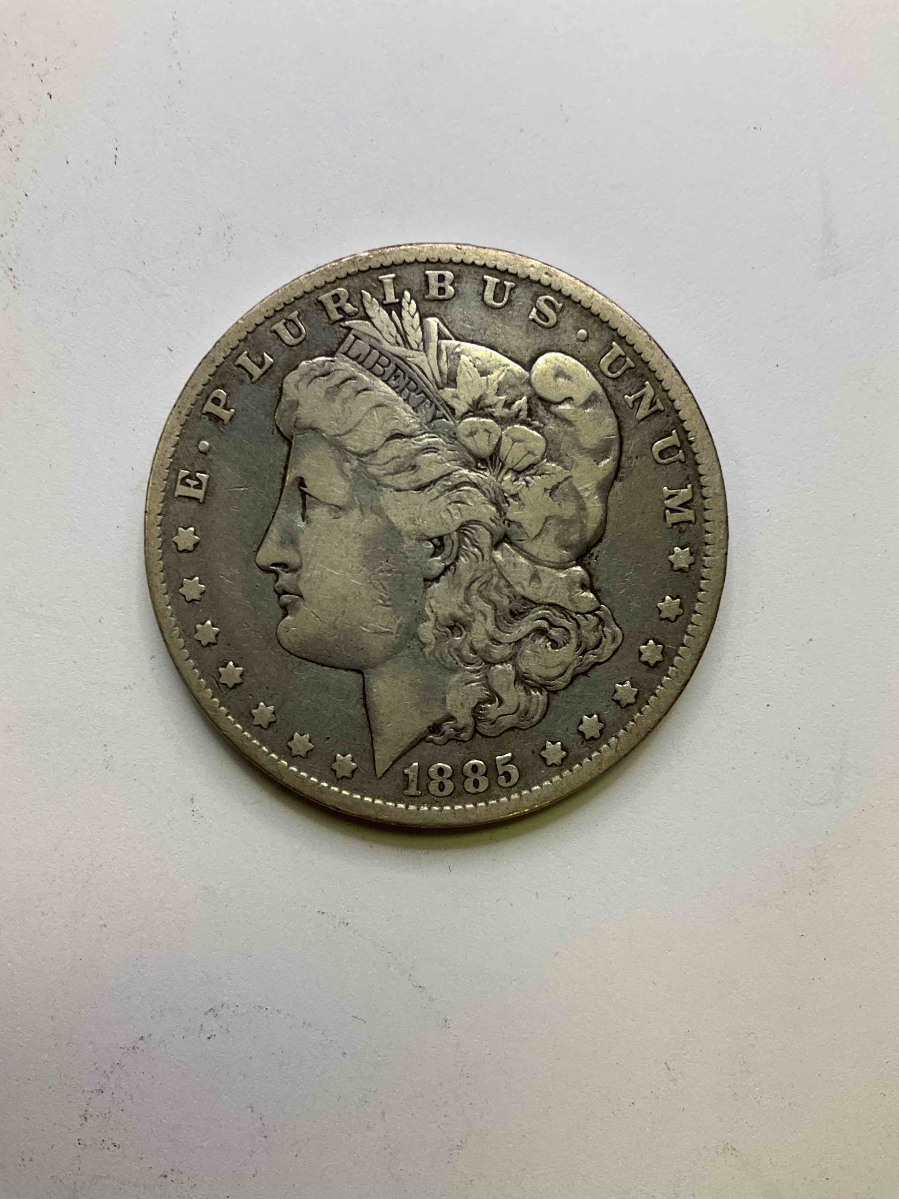 1885 Silver Morgan Dollar U.S. Coin! Morgan Dollars Were Minted From 1878-1921 & Have Become One Of The Most Collectible Coins In History. This Large, Circulated, 1.5" Diameter, Heavy, Gorgeous Coin Is 90% Silver & 10% Copper, Giving It A Net Weight of .77344 oz. Of Pure Silver! Own A Valuable Piece Of History & An Incredible Investment In Precious Metals!