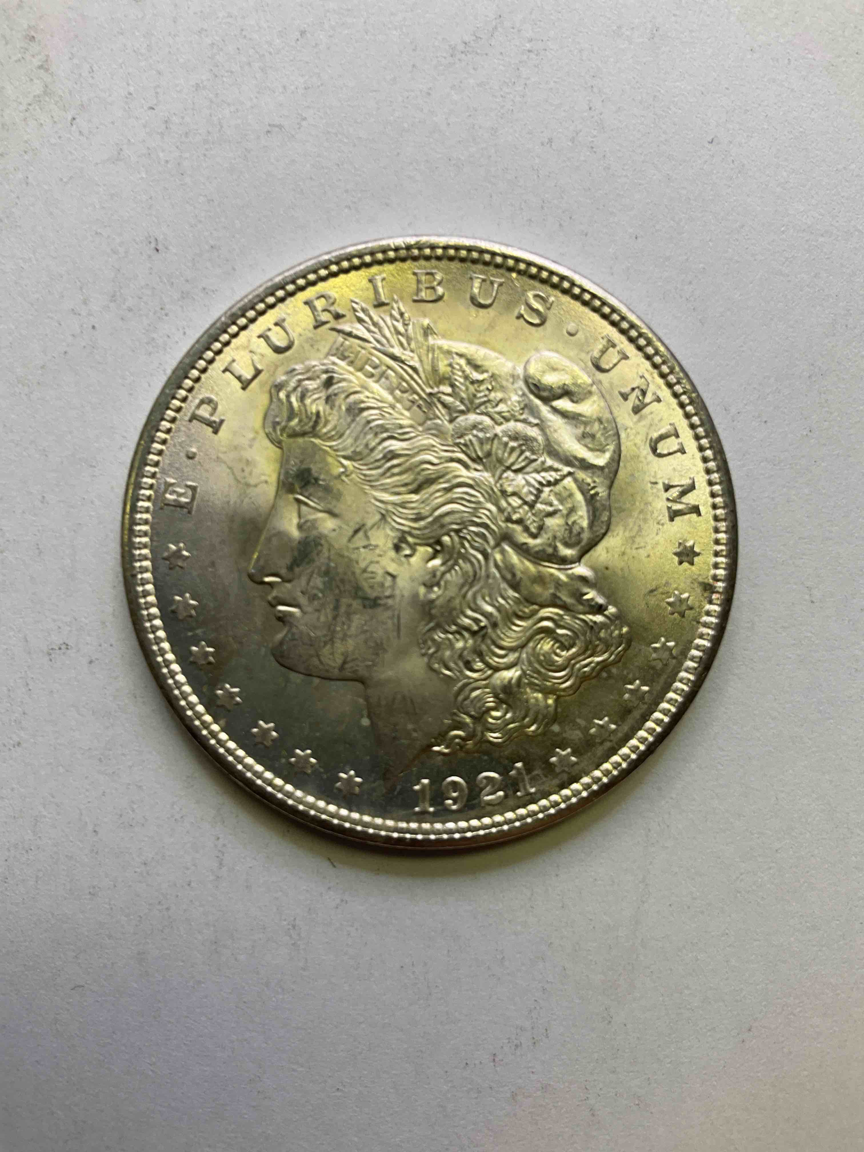 1921 Silver Morgan Dollar U.S. Coin, Last year Mintage! Morgan Dollars Were Minted From 1878-1921 & Have Become One Of The Most Collectible Coins In History. Last Year Of Mintage For This Coin! This Large, Circulated, 1.5" Diameter, Heavy, Gorgeous Coin Is 90% Silver & 10% Copper, Giving It A Net Weight of .77344 oz. Of Pure Silver! Own A Valuable Piece Of History & An Incredible Investment In Precious Metals!