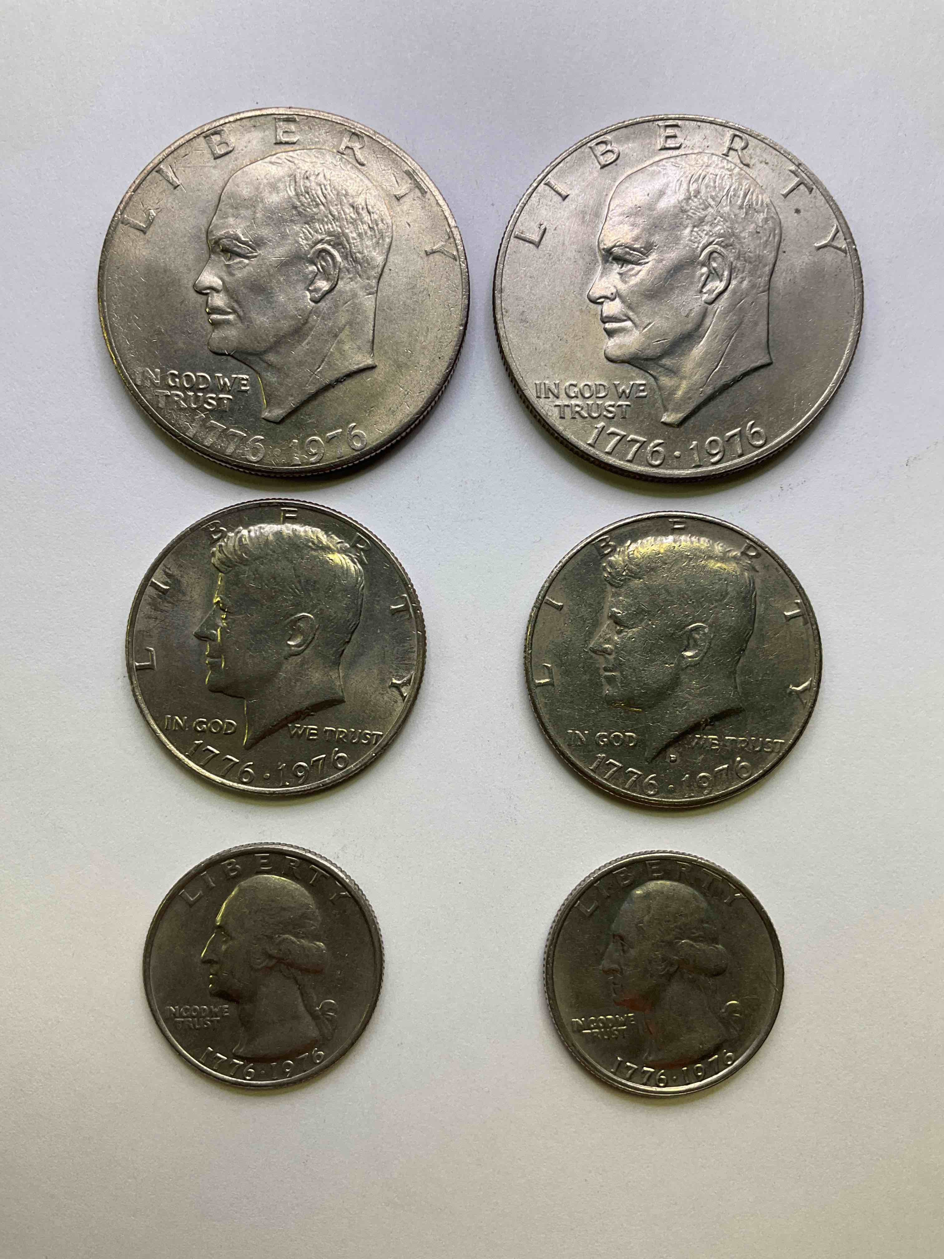 1976 Bicentennial Bliss! In 1976 The U.S. Mint Produced Coins Celebrating The 200 Year Anniversary Of America. Up For Auction Are Awesome Examples Of All Three Coins Produced For This... The Quarter, Half Dollar & Dollar Coin! Dollar Coins Show Great Toning, Highly Desirable For Collectors! Own Pieces Of History & Get Ready For America's 250 Year Anniversary Coming Soon!