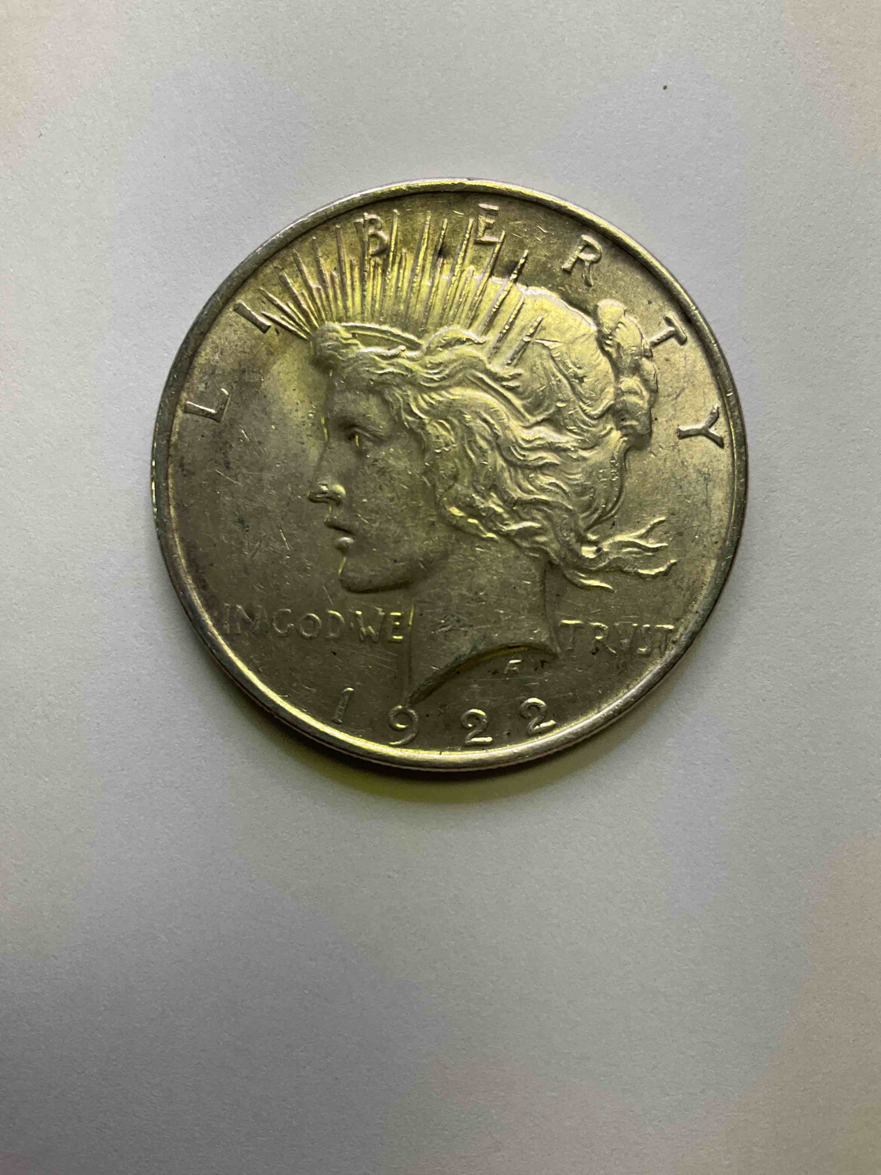 1922 Silver Peace Dollar U.S. Coin! Silver Peace Dollars Were Produced From 1921-1935 To Commemorate The End Of World War One. This Large, 1.5" Diameter, Heavy, Gorgeous Coin Is 90% Silver & 10% Copper, Giving It A Net Weight of .77344 oz. Of Pure Silver! Own A Valuable Piece Of History & An Incredible Investment In Precious Metals!