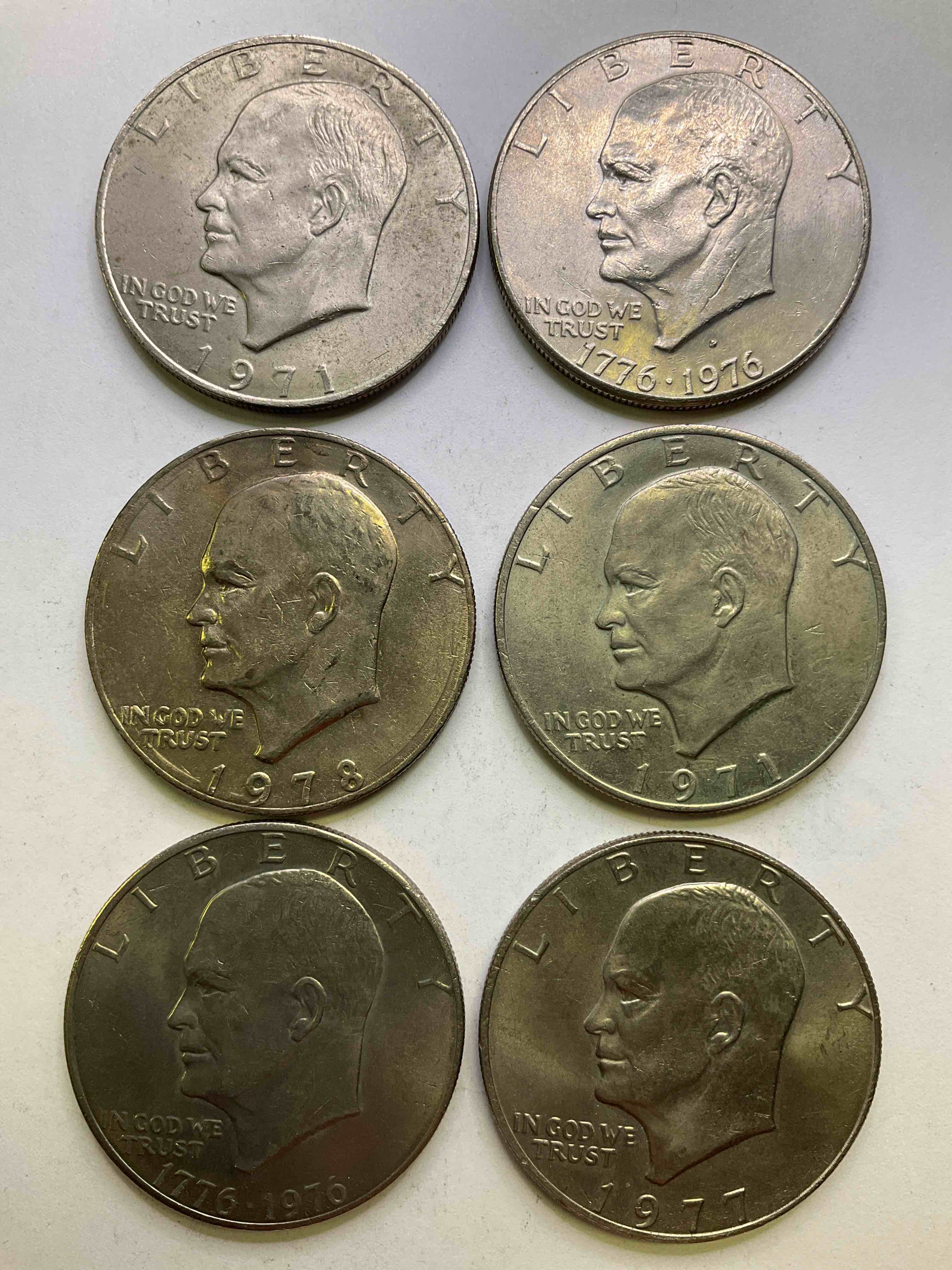 Eisenhower Dollar Coins! These Striking, Large U.S. Coins Were Minted From 1971-1978. Here Are Gorgeous Of Examples Of "Ike" Dollars In Varying Years, Including 1976 Bicentennial. These Coins Have Become Immensely Popular With Collectors & Some Have Great Toning!