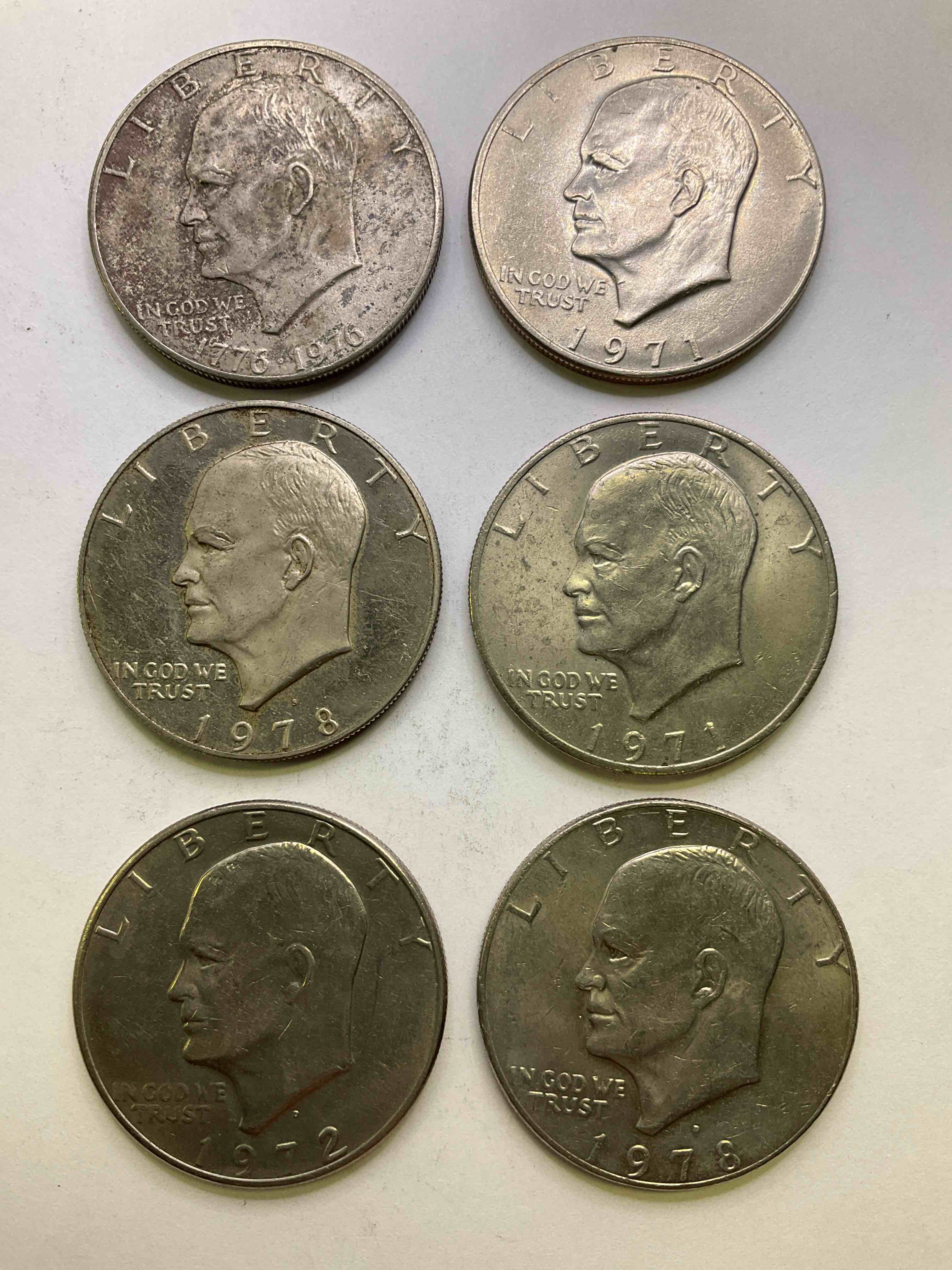 Eisenhower Dollar Coins! These Striking, Large U.S. Coins Were Minted From 1971-1978. Here Are Gorgeous Of Examples Of "Ike" Dollars In Varying Years, Including 1976 Bicentennial. These Coins Have Become Immensely Popular With Collectors & Some Have Great Toning!