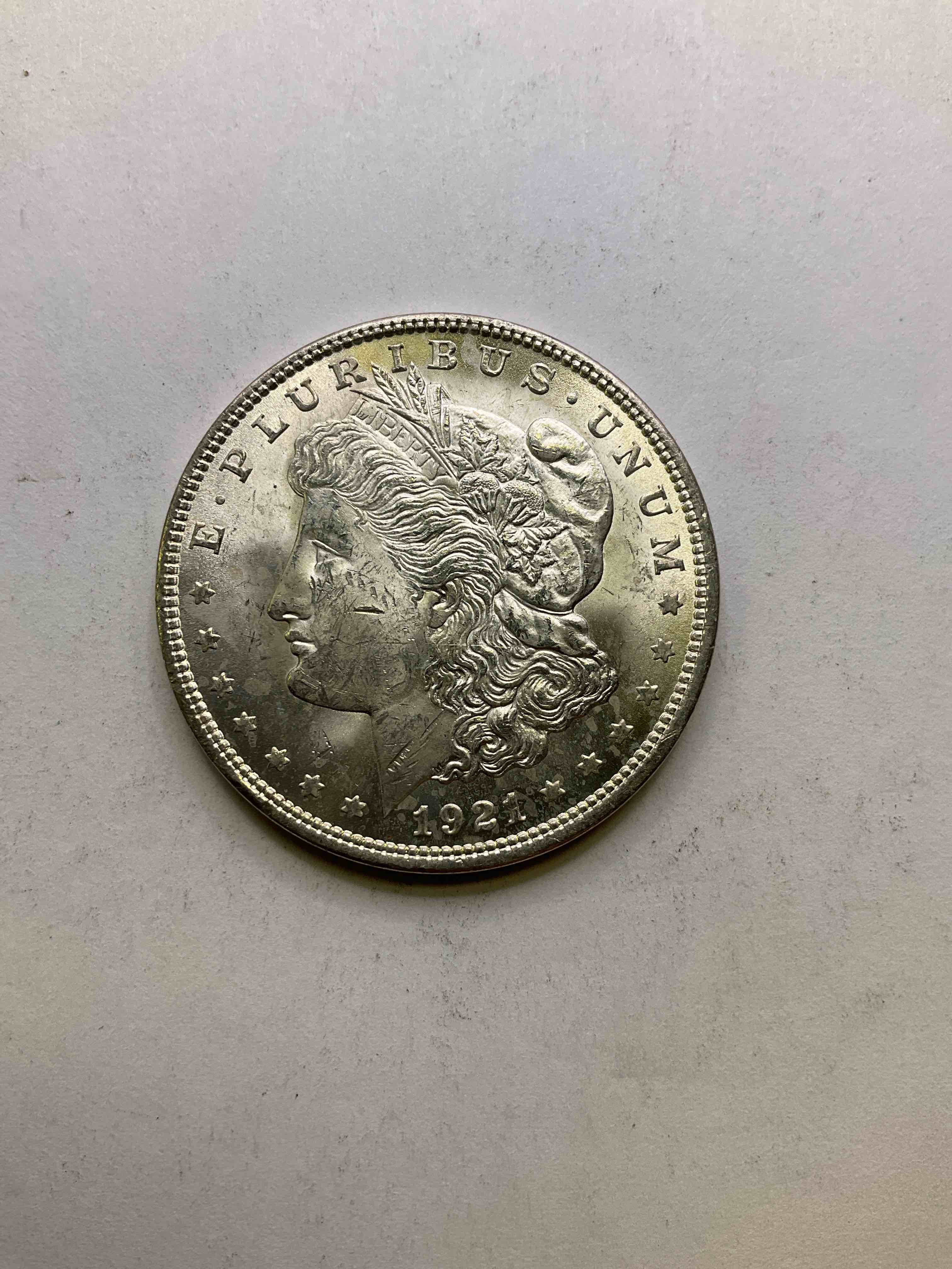 1921 Silver Morgan Dollar U.S. Coin, Last year Mintage! Morgan Dollars Were Minted From 1878-1921 & Have Become One Of The Most Collectible Coins In History. Last Year Of Mintage For This Coin! This Large, Circulated, 1.5" Diameter, Heavy, Gorgeous Coin Is 90% Silver & 10% Copper, Giving It A Net Weight of .77344 oz. Of Pure Silver! Own A Valuable Piece Of History & An Incredible Investment In Precious Metals!