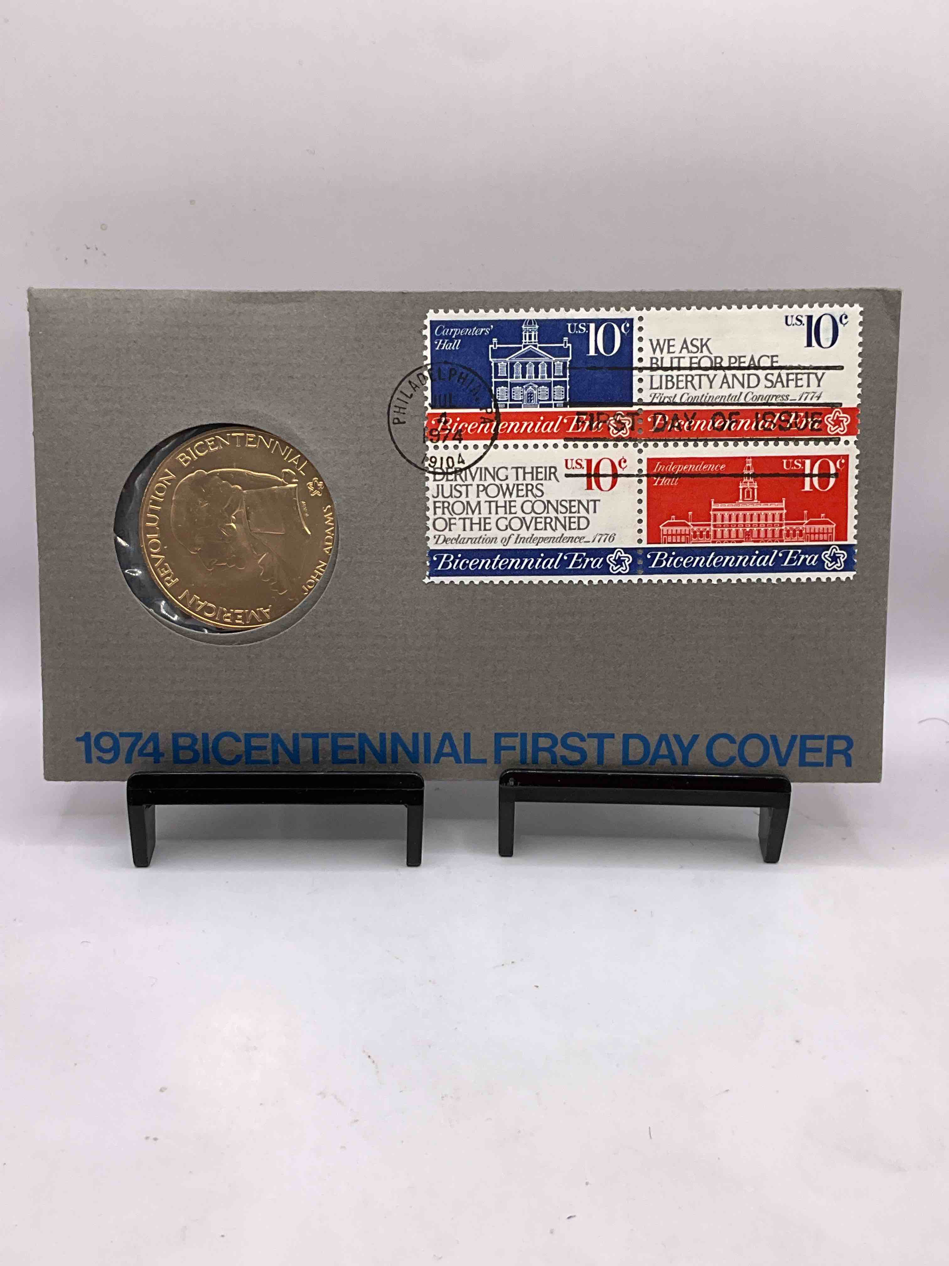 1974 Bicentennial Cool Piece Of History! Check This Out! 1974 John Adams American Revolution Bicentennial Commemorative Medal... Still In Its Original Envelope Directly Issued From The U.S. Treasury and Post Marked JULY 4, 1974 FIRST DAY OF ISSUE! This Gorgeous American Revolution Commemorative Coin Is Gold In Color But NOT Actual Gold / Precious Metal. A Cool Piece Of History You May Never Come Across Again, In Original Post-Marked Envelope!