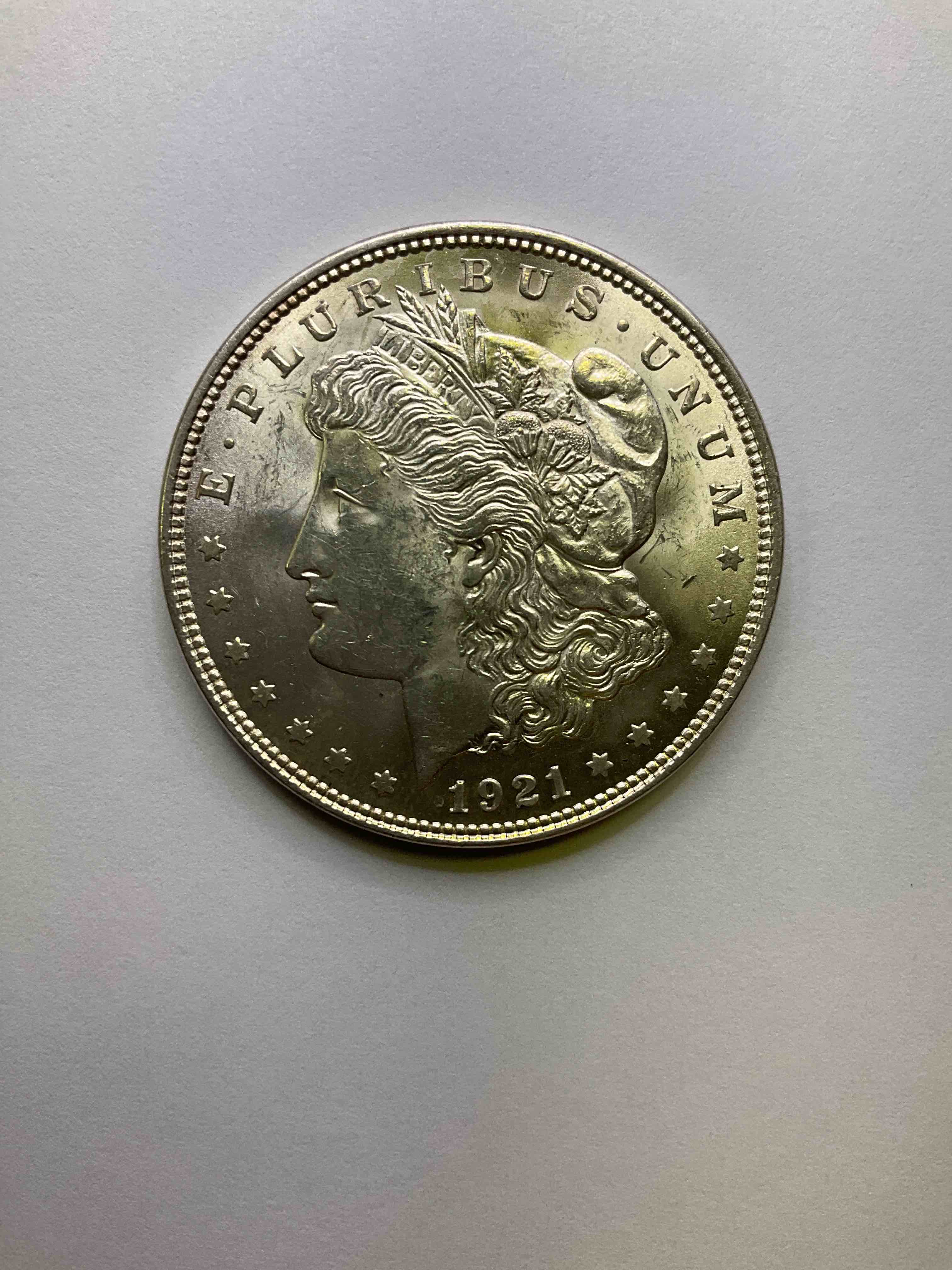 1921 Silver Morgan Dollar U.S. Coin, Last year Mintage! Morgan Dollars Were Minted From 1878-1921 & Have Become One Of The Most Collectible Coins In History. Last Year Of Mintage For This Coin! This Large, Circulated, 1.5" Diameter, Heavy, Gorgeous Coin Is 90% Silver & 10% Copper, Giving It A Net Weight of .77344 oz. Of Pure Silver! Own A Valuable Piece Of History & An Incredible Investment In Precious Metals!