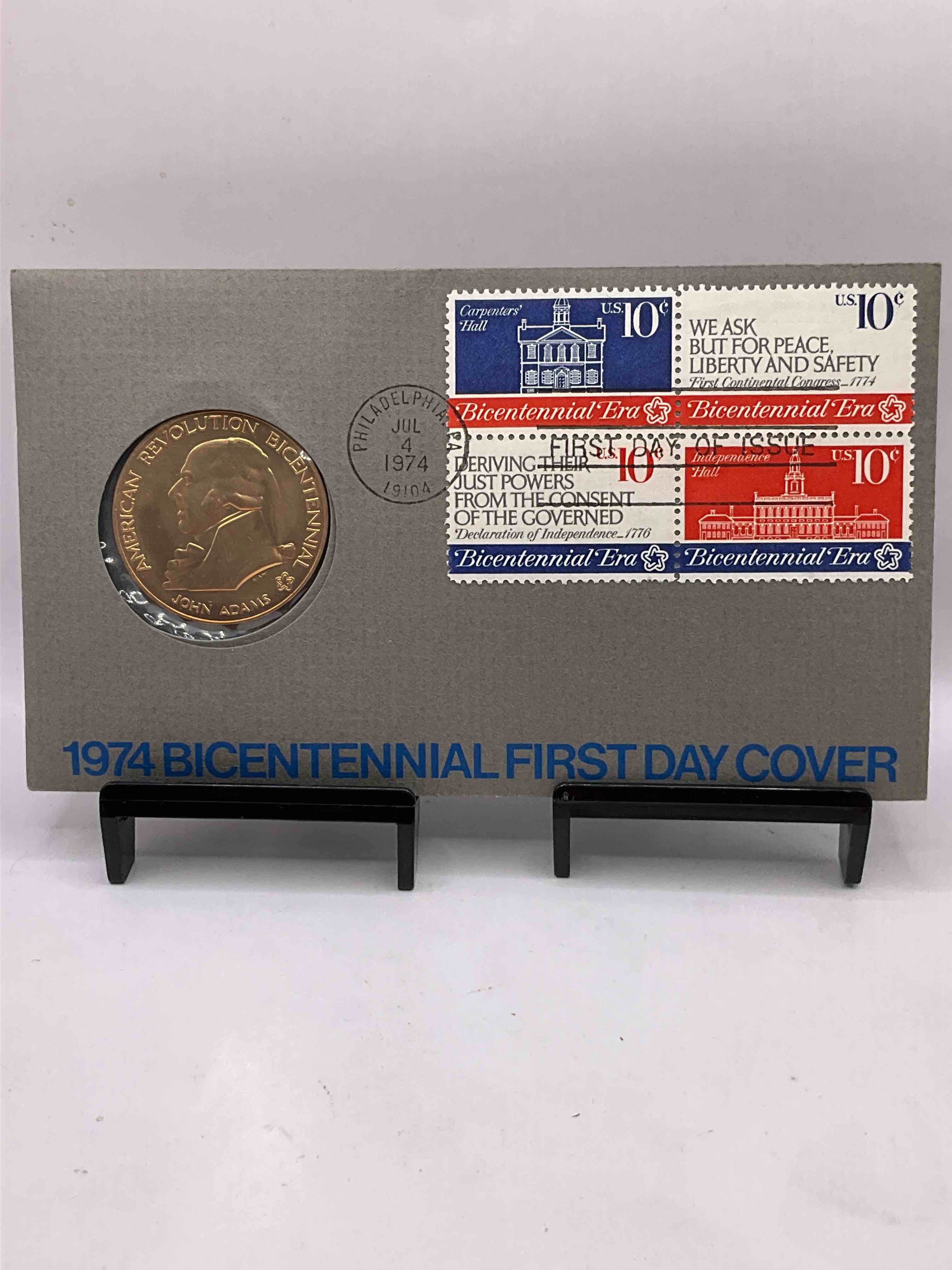 1974 Bicentennial Cool Piece Of History! Check This Out! 1974 John Adams American Revolution Bicentennial Commemorative Medal... Still In Its Original Envelope Directly Issued From The U.S. Treasury and Post Marked JULY 4, 1974 FIRST DAY OF ISSUE! This Gorgeous American Revolution Commemorative Coin Is Gold In Color But NOT Actual Gold / Precious Metal. A Cool Piece Of History You May Never Come Across Again, In Original Post-Marked Envelope!
