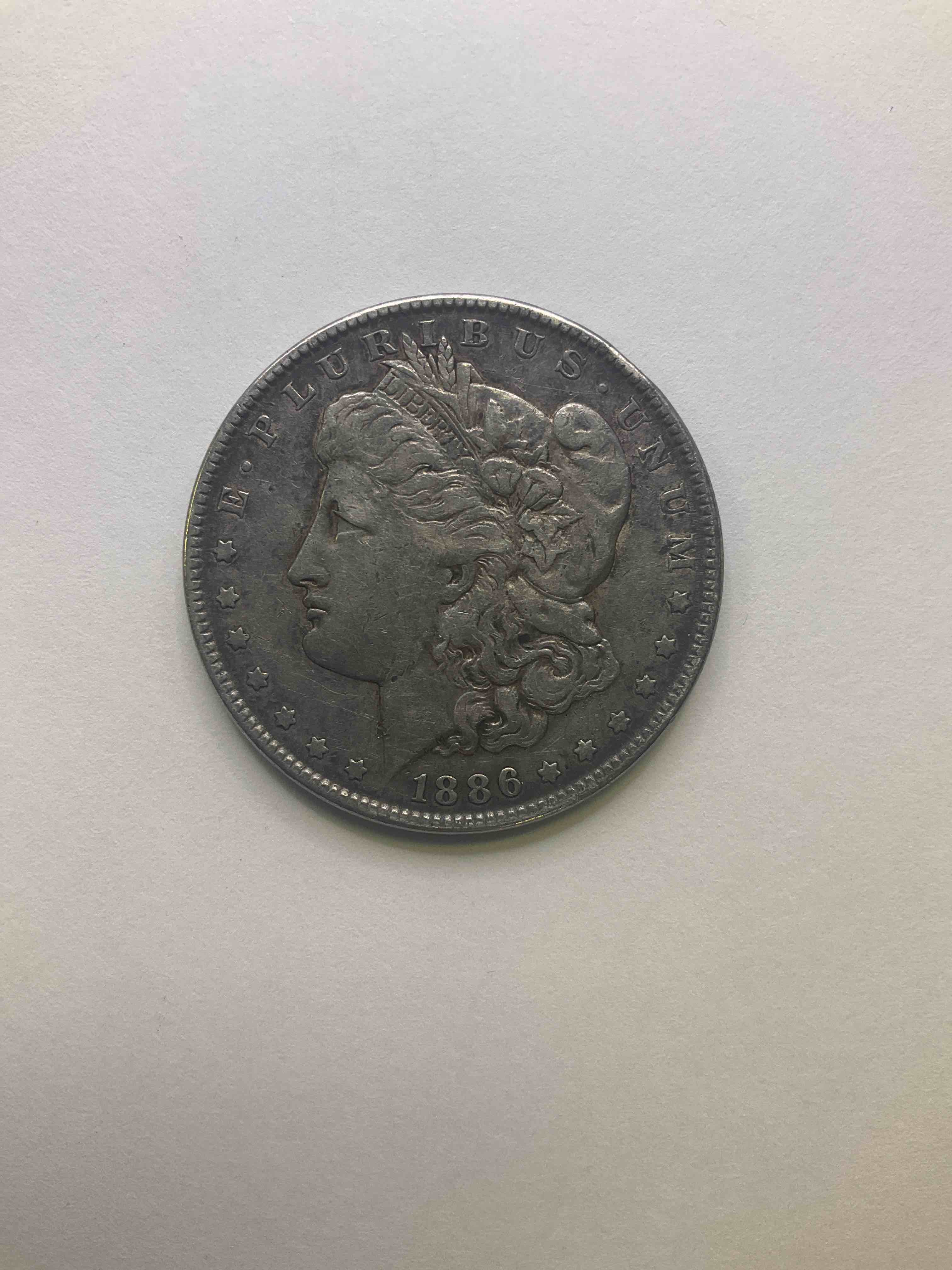 1886 Silver Morgan Dollar U.S. Coin In Very Nice Condition! Morgan Dollars Were Minted From 1878-1921 & Have Become One Of The Most Collectible Coins In History. This Large, Circulated, 1.5" Diameter, Heavy. Gorgeous Coin Is 90% Silver & 10% Copper, Giving I A Net Weight of .77344 oz. Of Pure Silver! Own A Valuable Piece Of History & An Incredible Investment In Precious Metals!