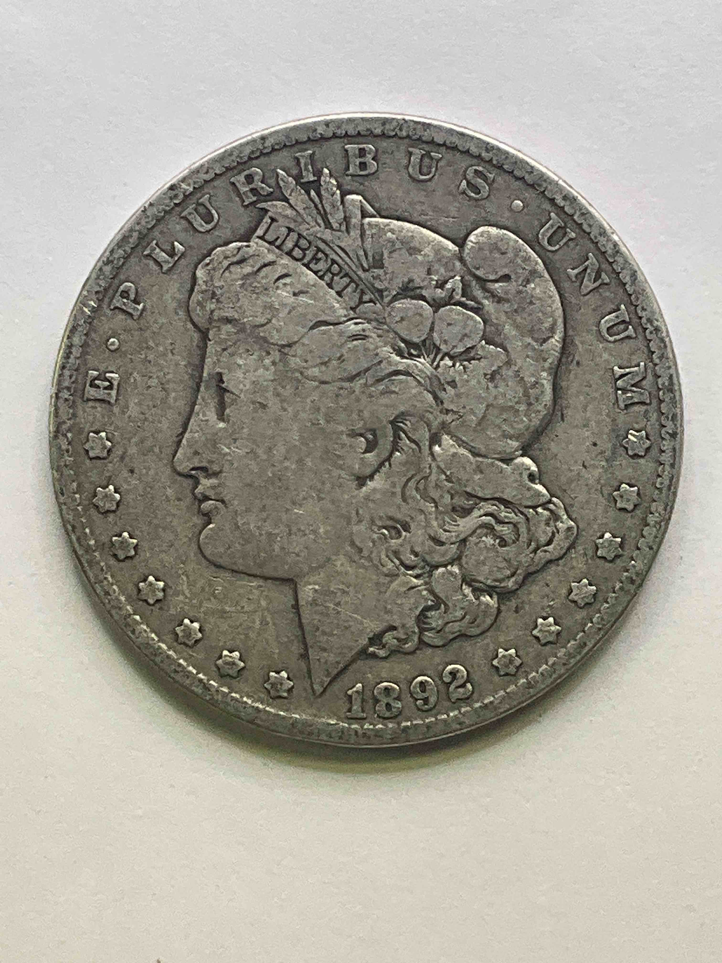 1892 Silver Morgan Dollar U.S. Coin In Very Nice Condition! Morgan Dollars Were Minted From 1878-1921 & Have Become One Of The Most Collectible Coins In History. This Large, Circulated, 1.5" Diameter, Heavy, Gorgeous Coin Is 90% Silver & 10% Copper, Giving It A Net Weight of .77344 oz. Of Pure Silver! Own A Valuable Piece Of History & An Incredible Investment In Precious Metals!