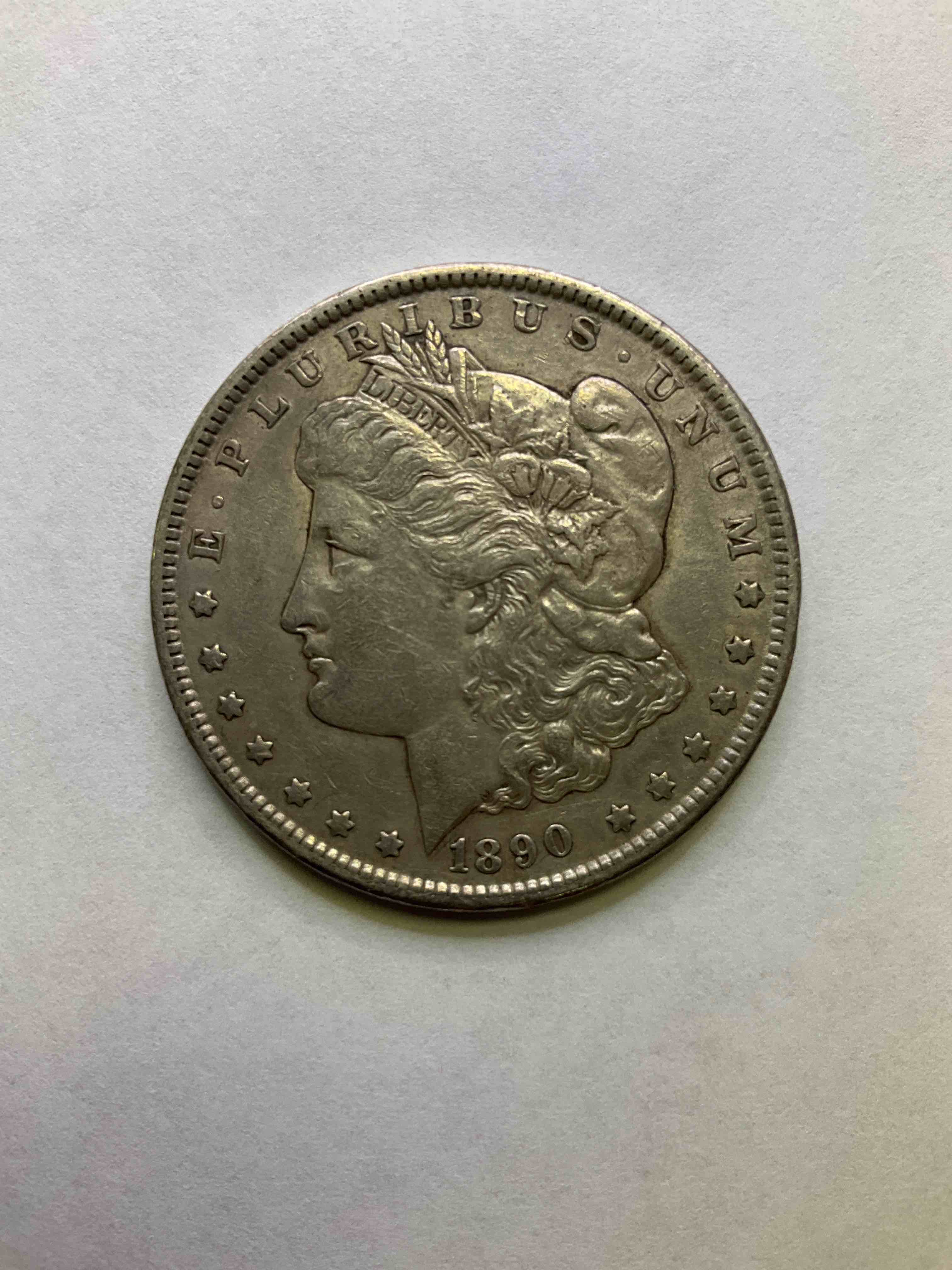 1890 Early Silver Morgan Dollar U.S. Coin, Rare To See In This Great Of Condition! Morgan Dollars Were Minted From 1878-1921 & Have Become One Of The Most Collectible Coins In History. This Large, Circulated, 1.5" Diameter, Heavy, Gorgeous Coin Is 90% Silver & 10% Copper, Giving It A Net Weight of .77344 oz. Of Pure Silver! Own A Valuable Piece Of History & An Incredible Investment In Precious Metals!