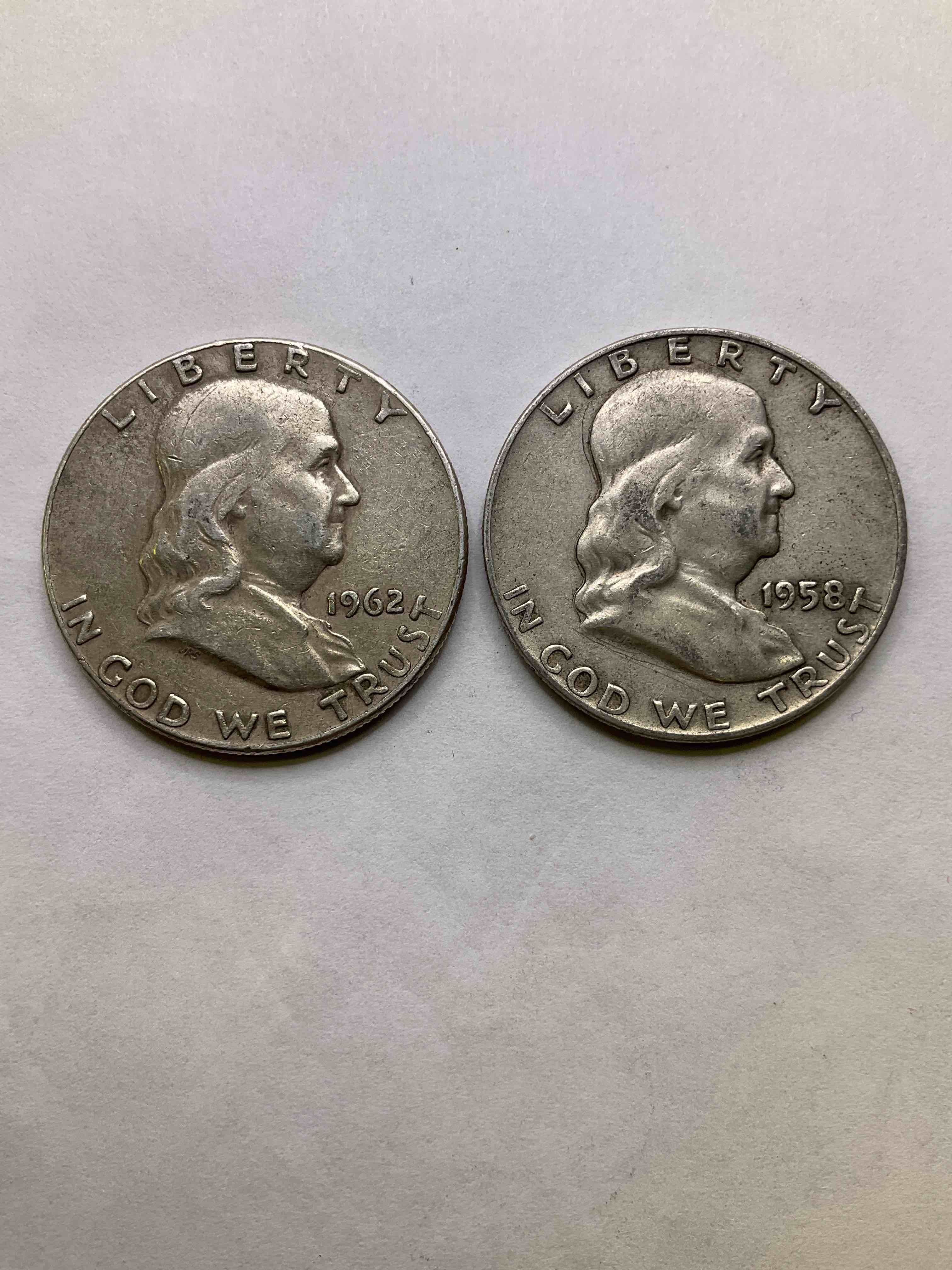 Ben Franklin Silver! 1950's/60's Silver U.S. Half Dollar Coins! Before 1965 American Half Dollars Were Actually Silver, Here Are Two Gorgeous Examples Of Rare Ben Franklin Silver Half Dollars, In Rare Years Of 1958 & 1962, In Great Circulated Condition. Great For Investing In Precious Metals! These Heavy Half Dollars Were Minted At 90% Silver and 10% Copper, Giving Them A Net Weight Of .36169 Ounces Of Pure Silver Per Coin! Very Rare In This Condition!