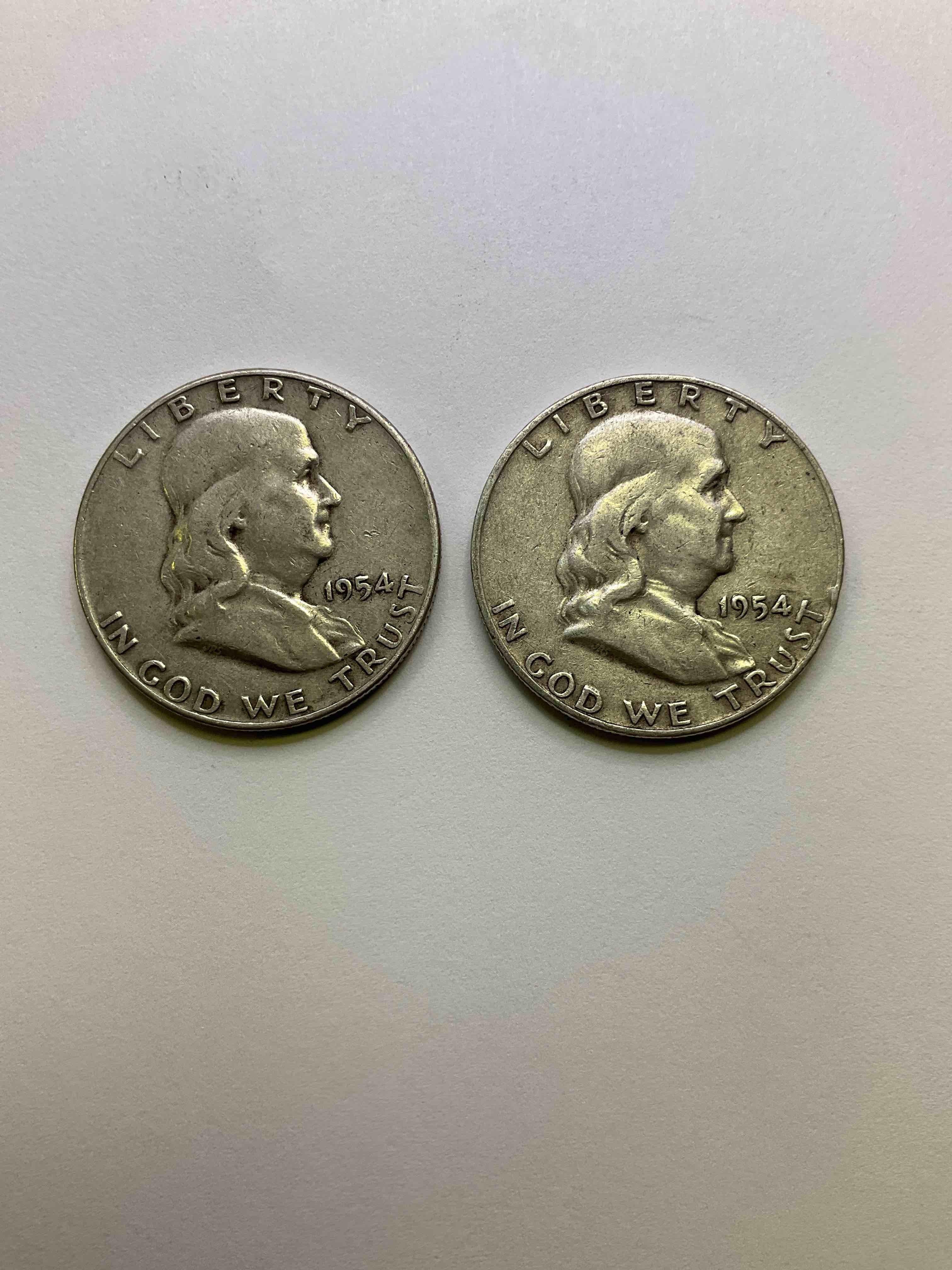 Ben Franklin Silver! 1950's Silver U.S. Half Dollar Coins! Before 1965 American Half Dollars Were Actually Silver, Here Are Two Gorgeous Examples Of Rare Ben Franklin Silver Half Dollars, In Rare Year Of 1954, In Great Circulated Condition. Great For Investing In Precious Metals! These Heavy Half Dollars Were Minted At 90% Silver and 10% Copper, Giving Them A Net Weight Of .36169 Ounces Of Pure Silver Per Coin! Very Rare In This Condition!