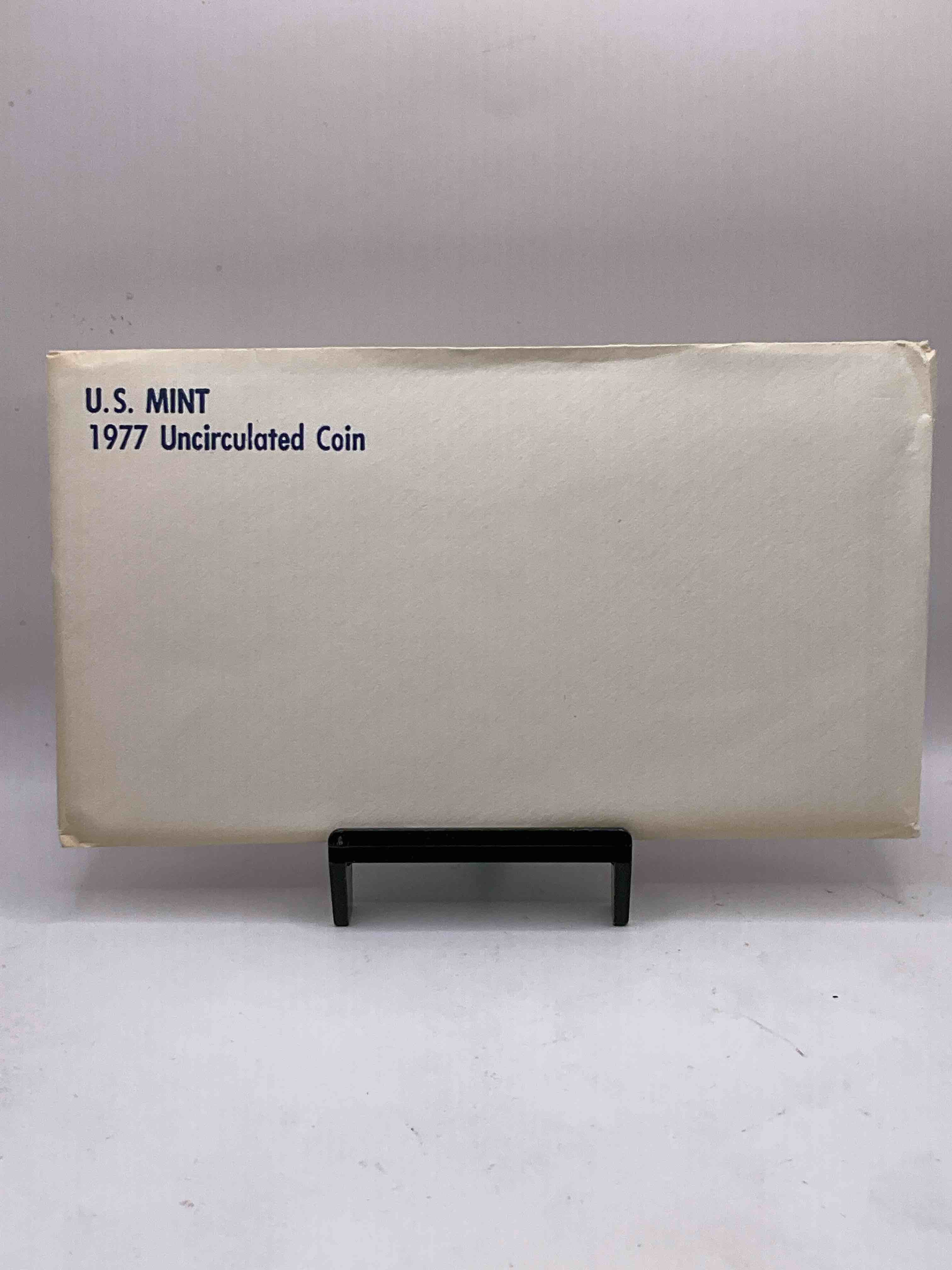 1977 U.S. Mint Set, "May The Force Be With You," The Year Of Star Wars! This Highly Collectible Mint Set Includes 10 Coins, Five Minted From Each Mint Location (Philly & Denver) That Year. Includes "Ike" Dollars! Still In Its Original Envelope Direct From The U.S. Treasury in 1977!