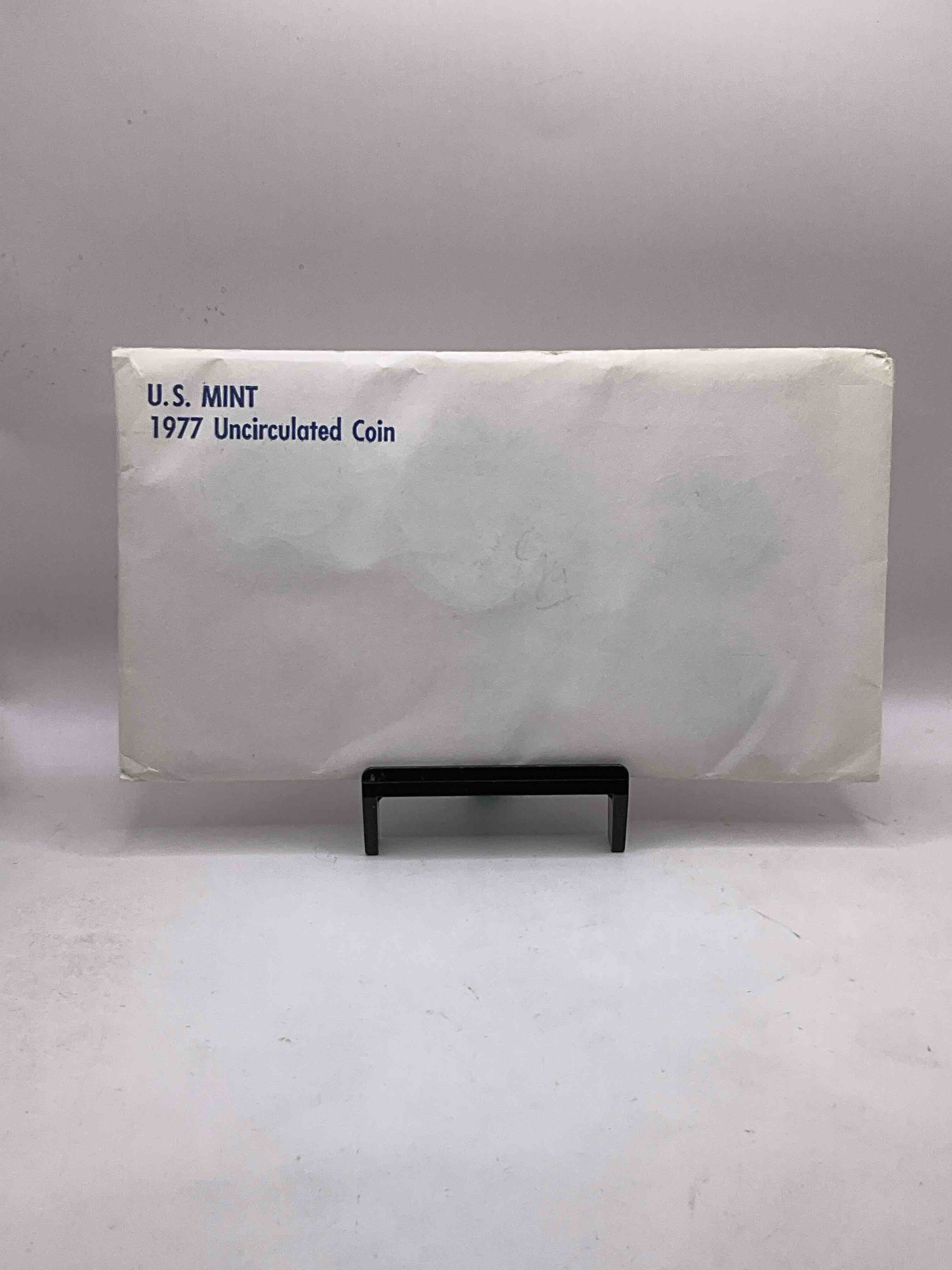 1977 U.S. Mint Set, "May The Force Be With You," The Year Of The Original Star Wars! This Highly Collectible Mint Set Includes 10 Coins, Five Minted From Each Mint Location (Philly & Denver) That Year. Includes "Ike" Dollars! Still In Its Original Envelope Direct From The U.S. Treasury in 1977!