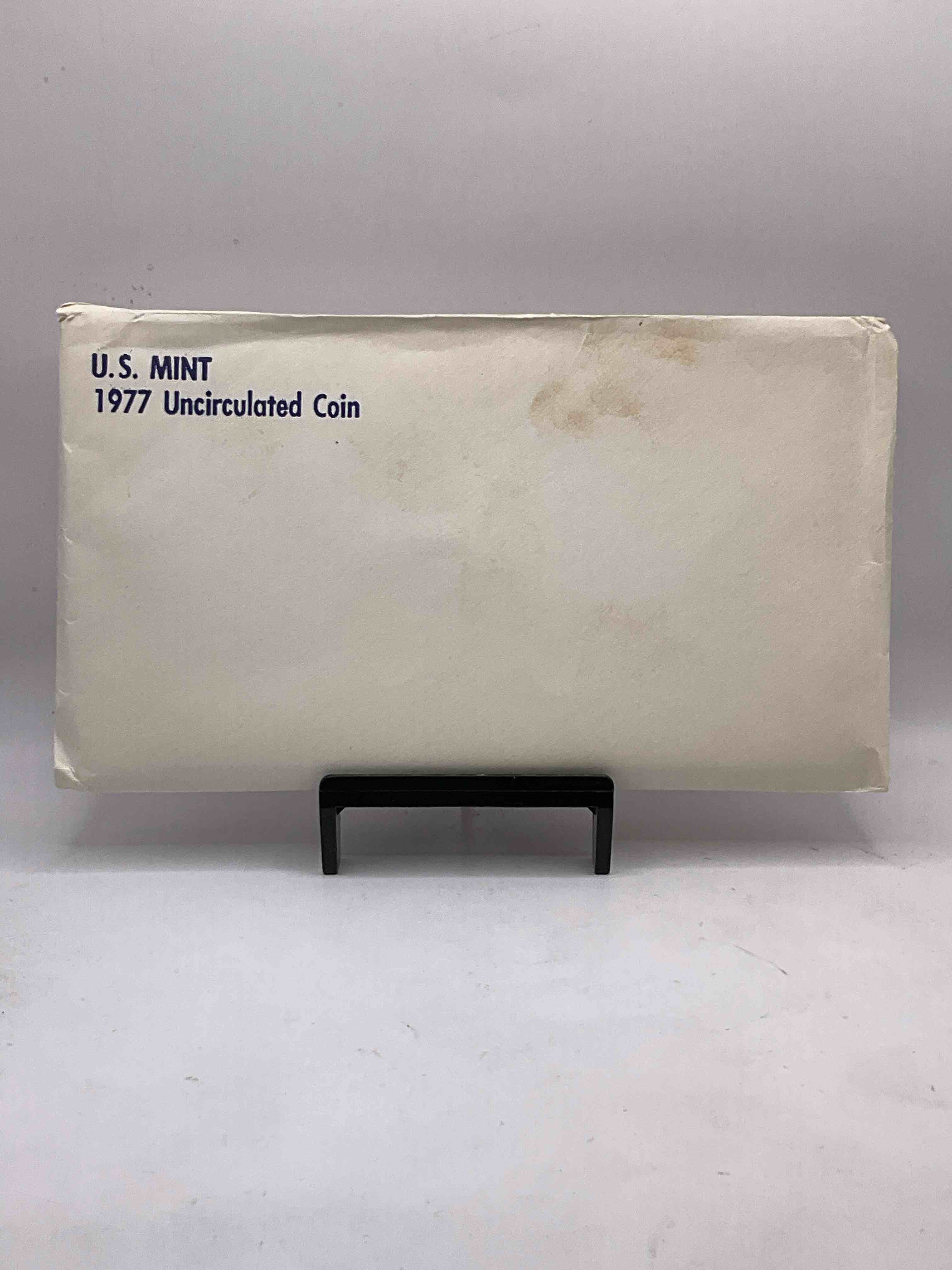 1977 U.S. Mint Set, "May The Force Be With You," The Year Of The Original Star Wars! This Highly Collectible Mint Set Includes 10 Coins, Five Minted From Each Mint Location (Philly & Denver) That Year. Includes "Ike" Dollars! Still In Its Original Envelope Direct From The U.S. Treasury in 1977!