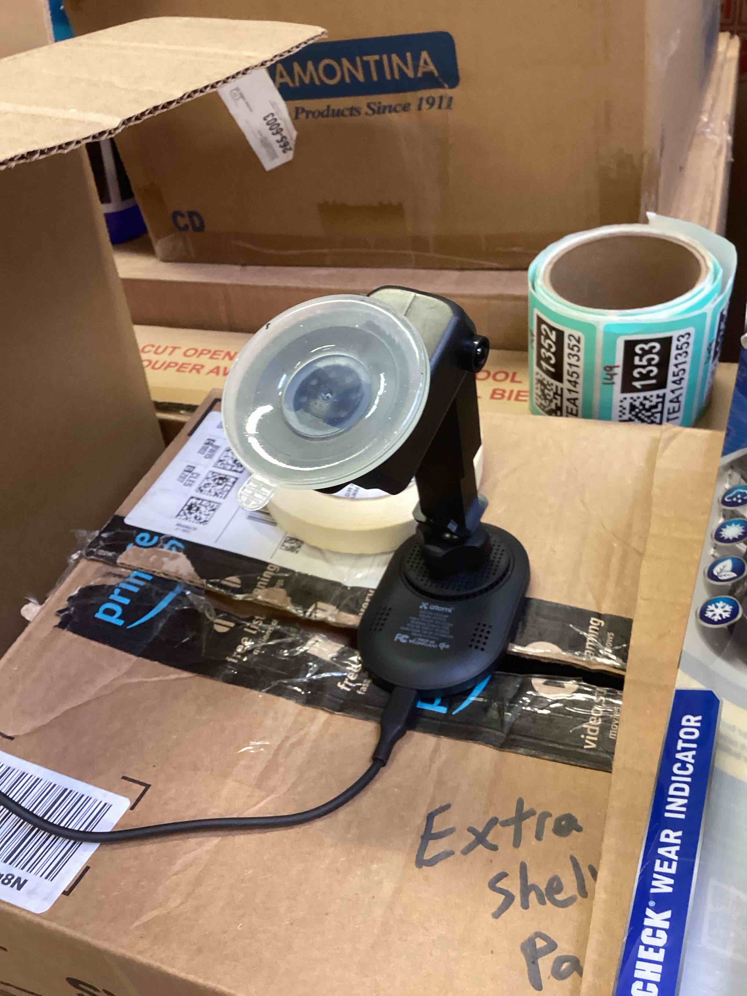 Assorted of articles, guest check, car charger, fly fan, flag, hearing aid batteries.