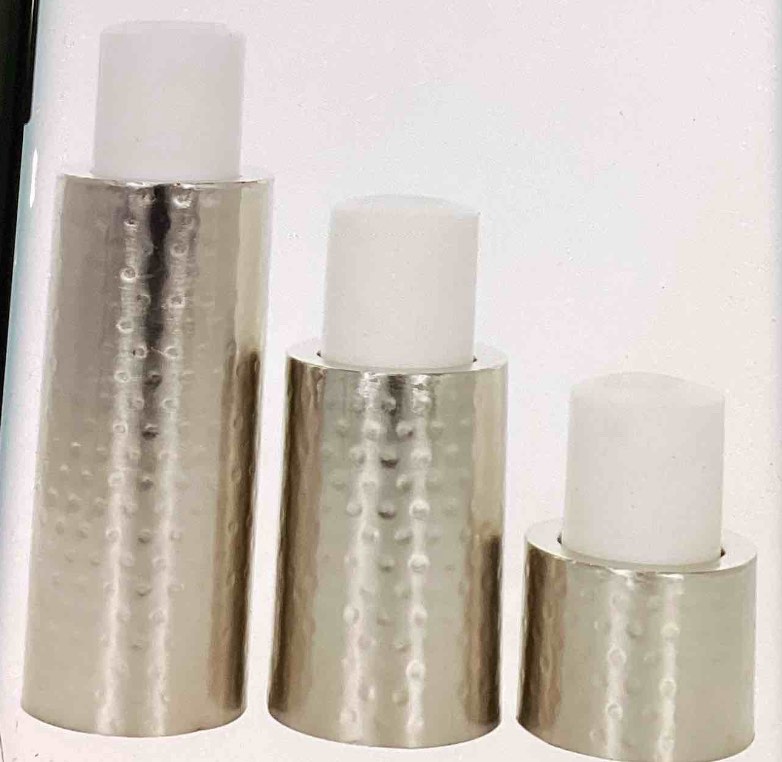 COSMOPOLITAN LIVING SILVER HANDMADE PILLAR SOLID ROUND *bottom have a missing cover see photos *