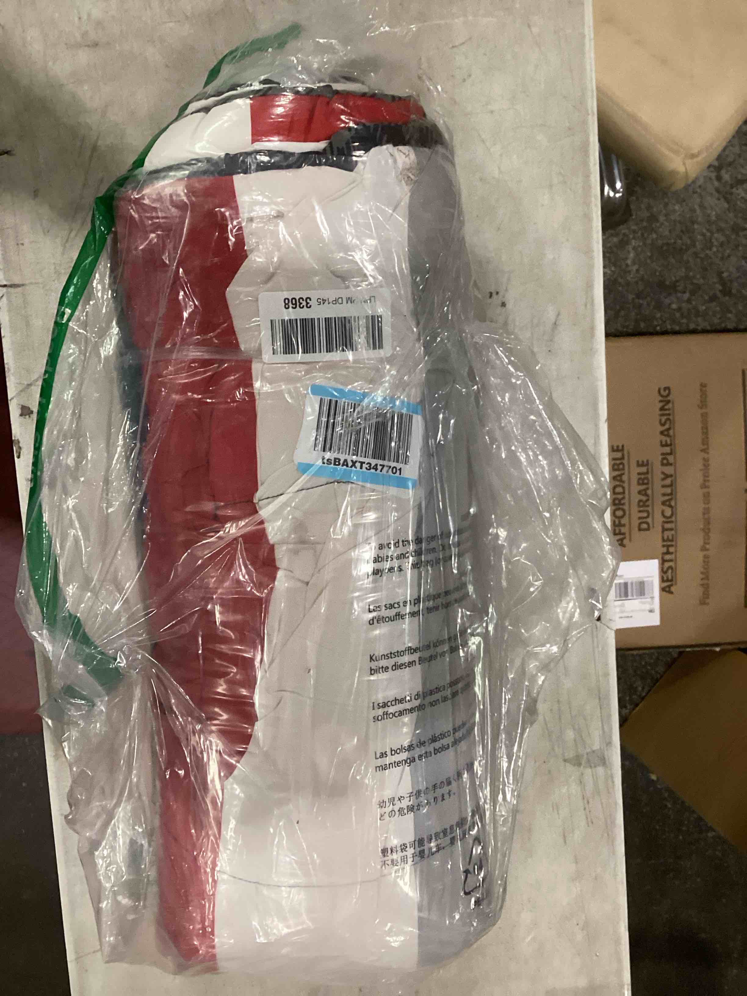 grey white red and black blanket 