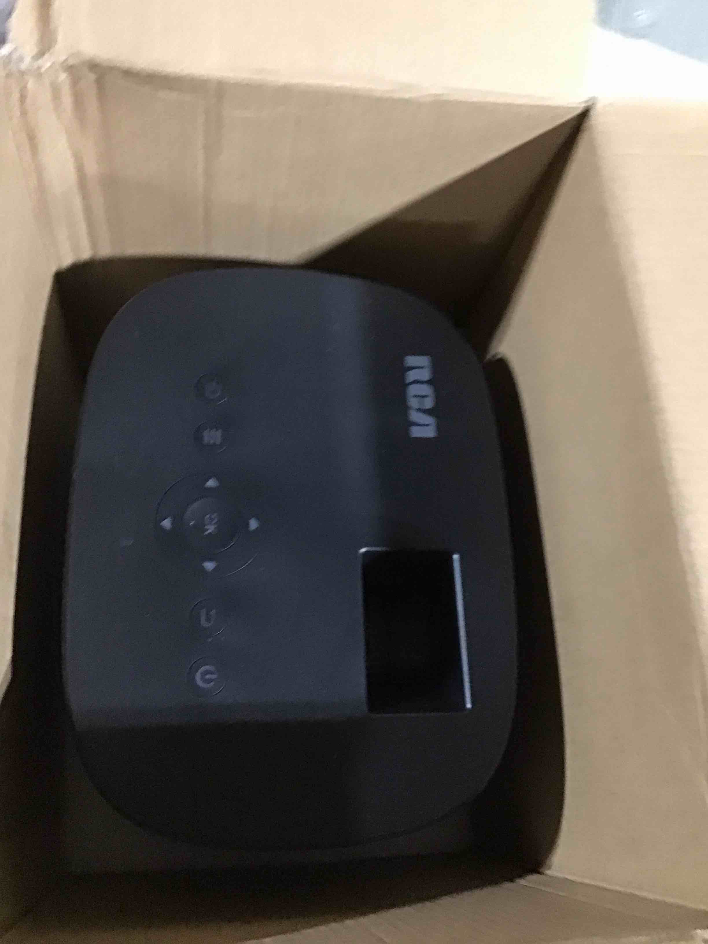 Condition photo showing As Is for RCA 720P Home Theater Projector, 1280 x 720 (720P), 4" LCD technology, 120 ANSI lumens, 32" to 140" (diagonal), 2 x HDMI - RPJ181-BLACK