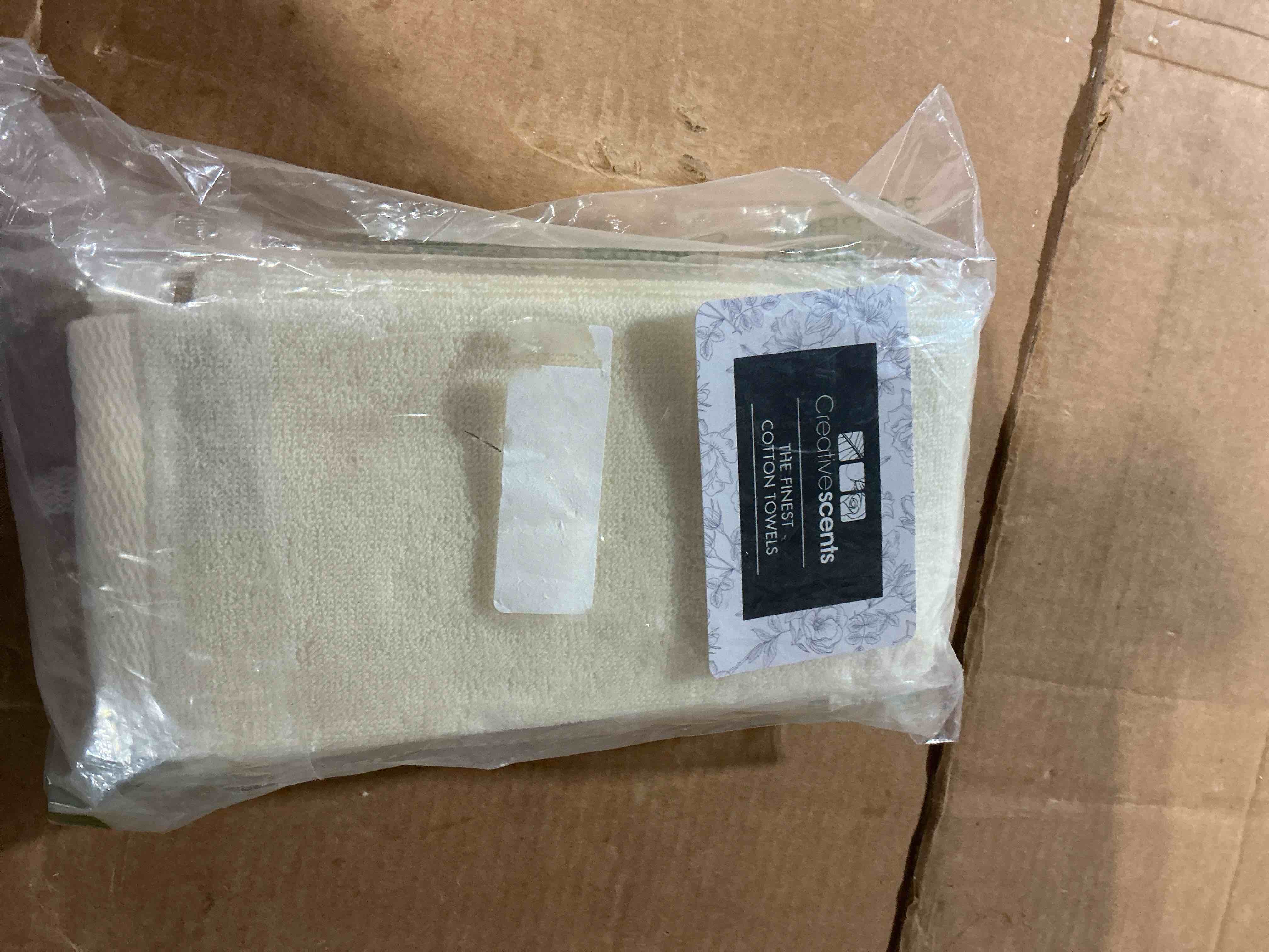 Condition photo showing New/Like New for creative scents 100% cotton velour fingertip towels - 4 pack 11 by 18 inch – decorative, extra absorbent and soft face towel, ideal for bathroom and powder room (cream with embroidered brown trim)
