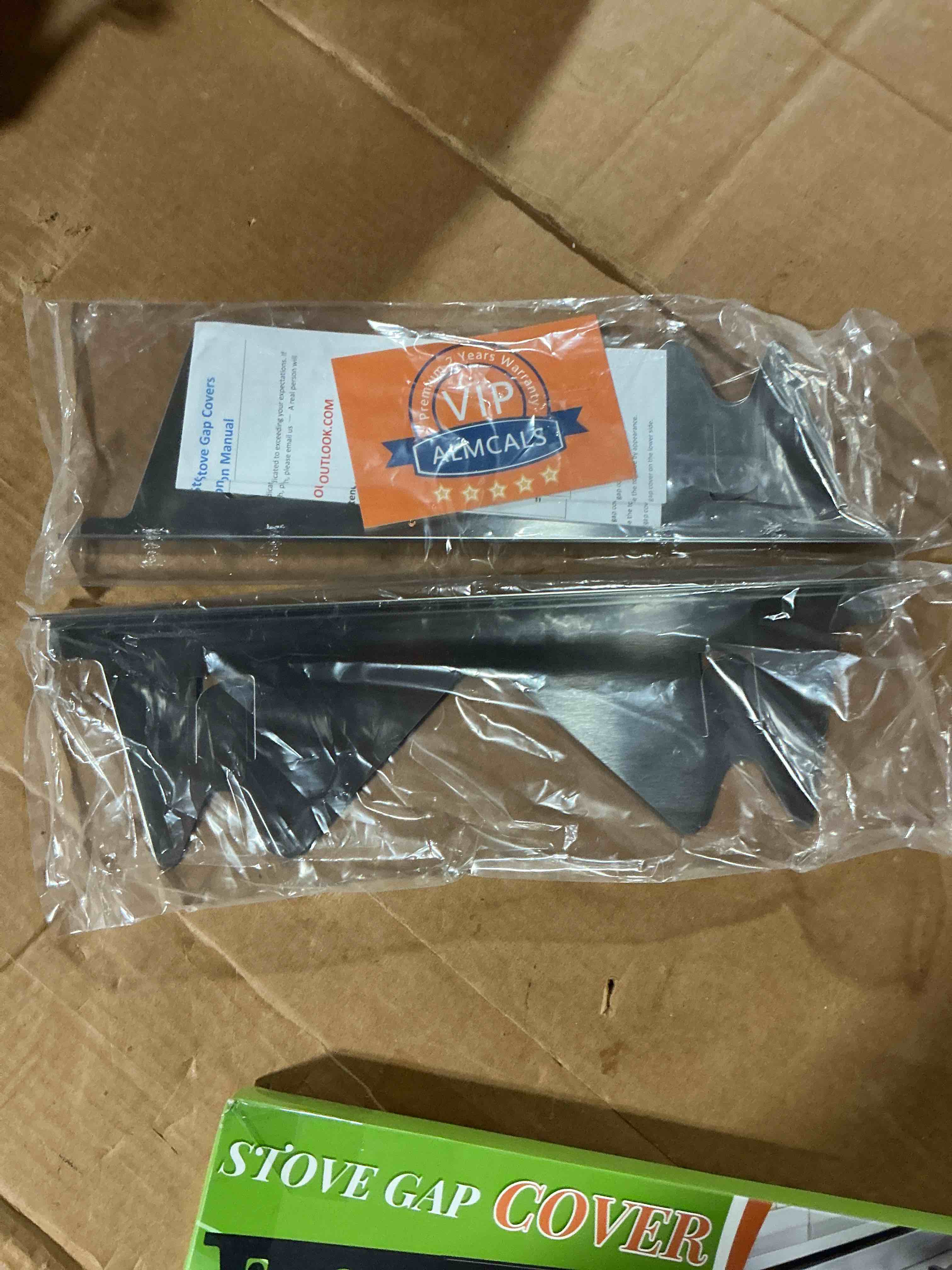 Condition photo showing New/Like New for stove gap covers stainless steel, 2 pack stove gap filler easy retractable length 13.8" to 27.5", width 0.79" almcals range trim kit, heat resistant guard between stove top & counter silver