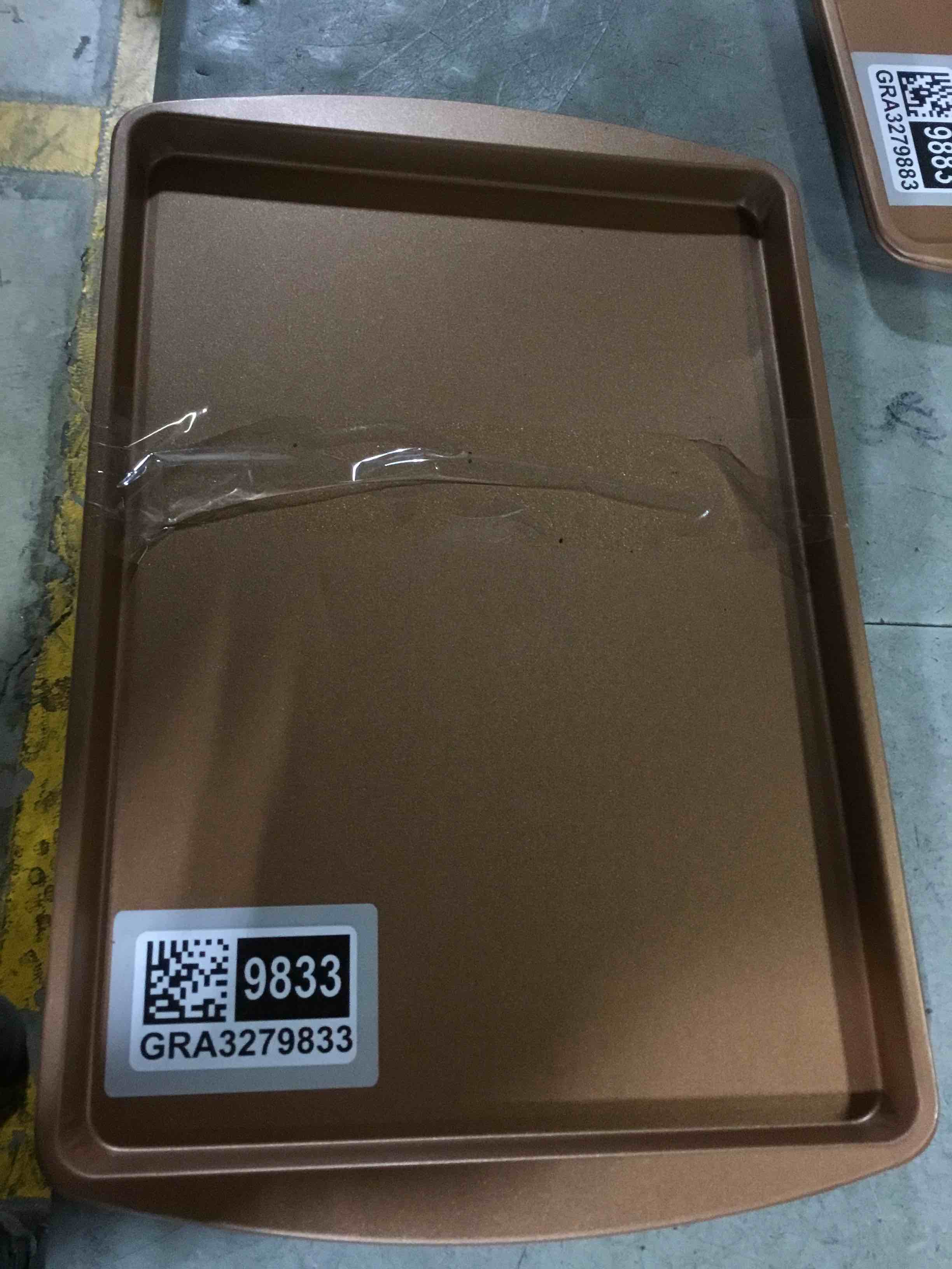 Condition photo showing As Is for (DENTED)(set of 2) 15”x9.5” copper cookie sheets 