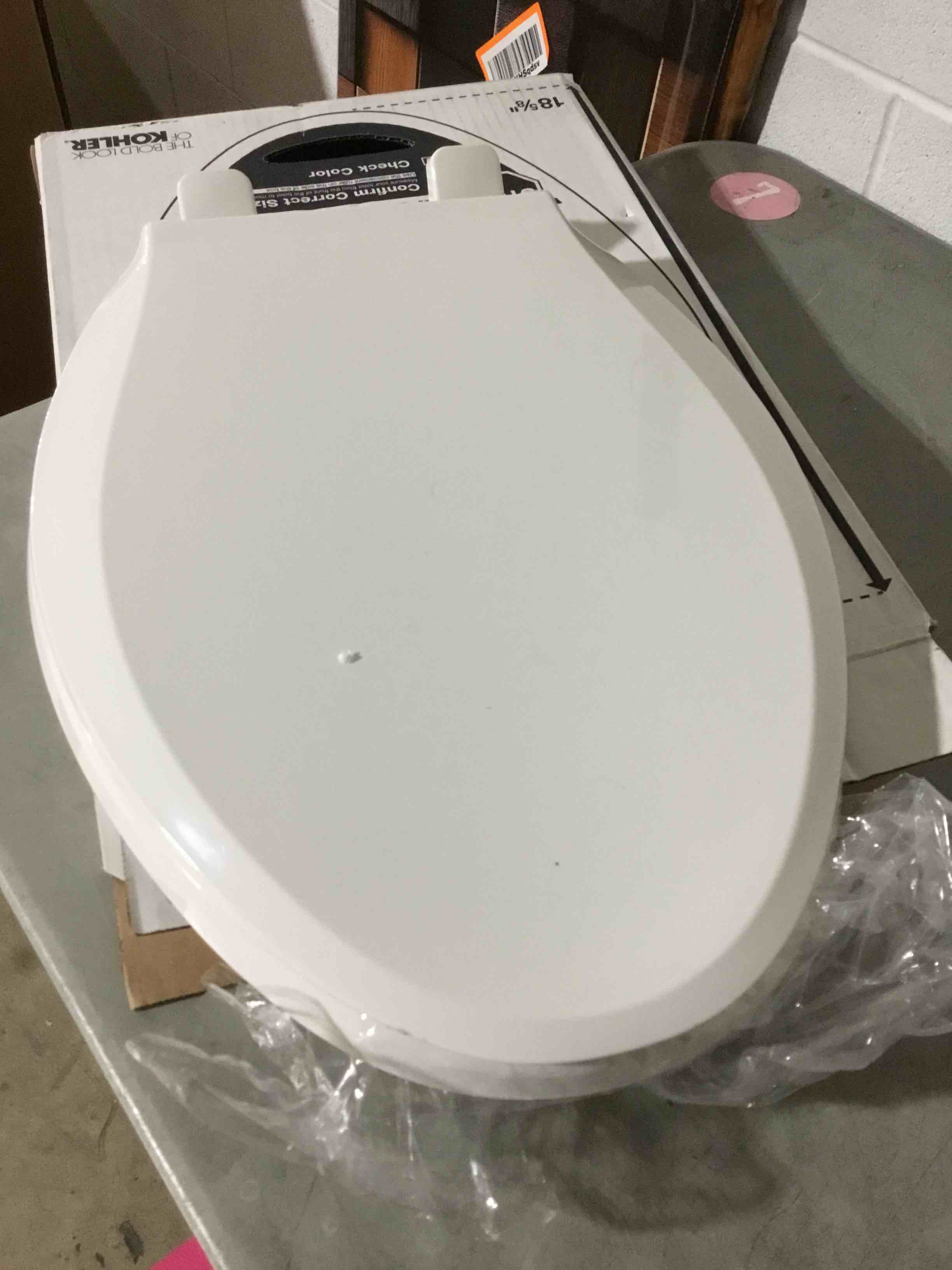 Condition photo showing As Is for KOHLER 4636-RL-0 Cachet ReadyLatch Elongated Toilet Seat Slow Close, Soft Close Toilet Seat Quiet Lid, Contoured Grip-Tight Bumpers Installation Hardware, Apartment Essentials, White White Elongated Ready Latch