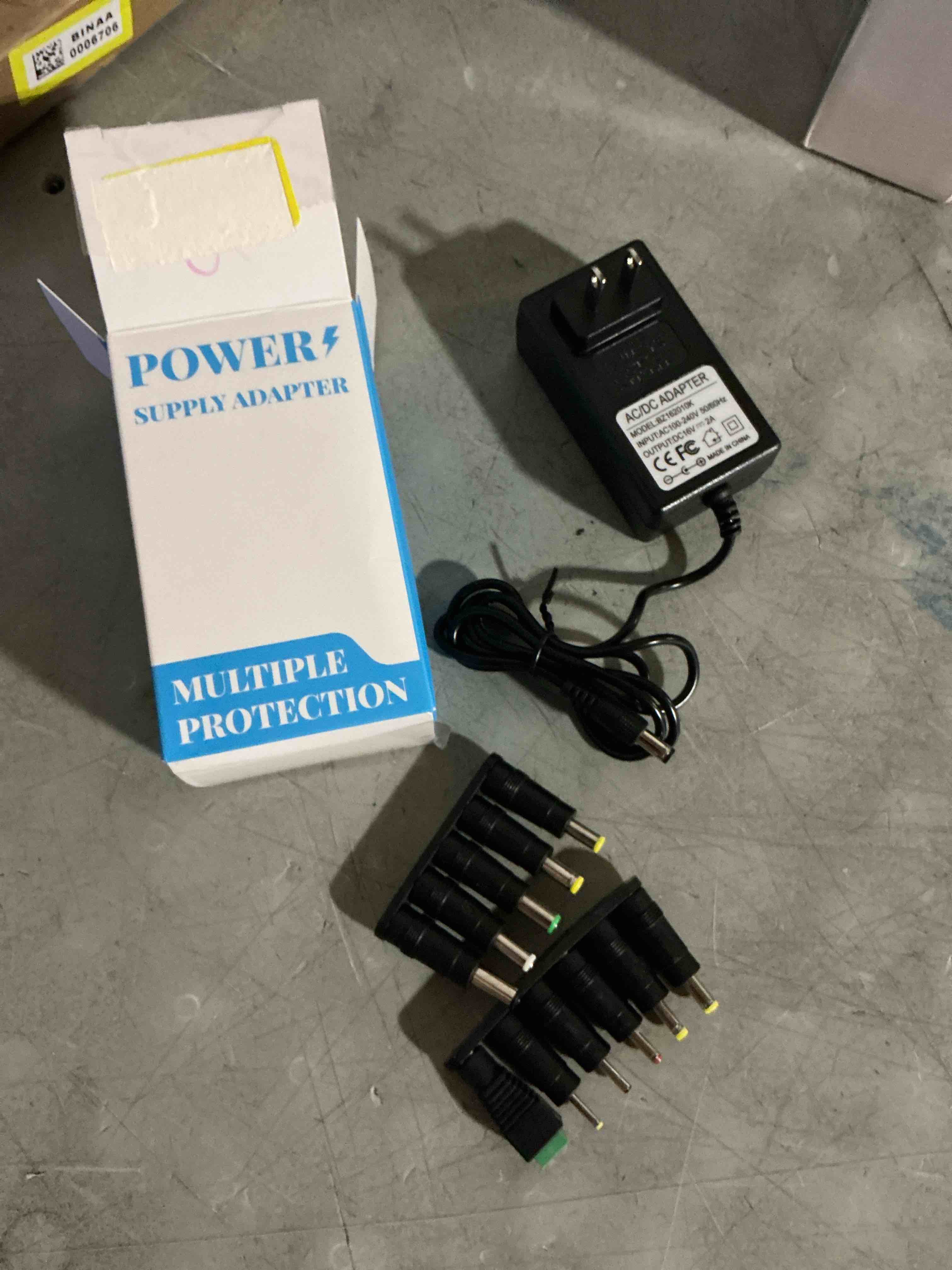 Condition photo showing New/Like New for 20v 2a power adapter supply with 5.5x2.1mm tip and 10 interchangeable jacks plug for 20 volts 2000ma 1000ma 800ma 500ma equipment ac110v to dc20v wall charger