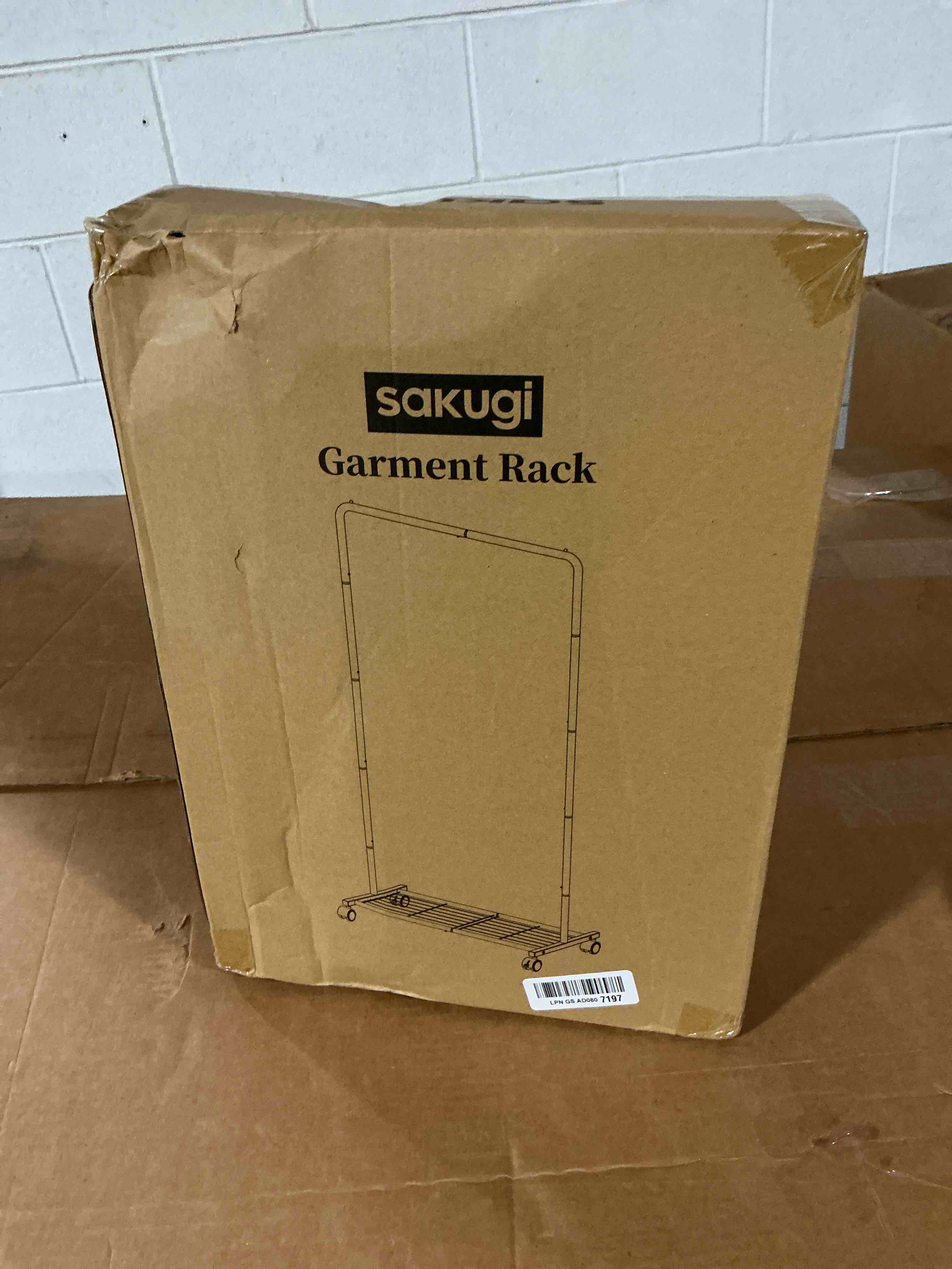 Condition photo showing New/Like New for sakugi clothes rack - clothing rack with storage mesh shelf & casters, heavy-duty metal clothing rack for hanging clothes, dresses, coats, large load capacity, easy assembly, black, 28.0"x16.9"x59.0" black 28.0" x 16.9" x 59.0" (1 rod)