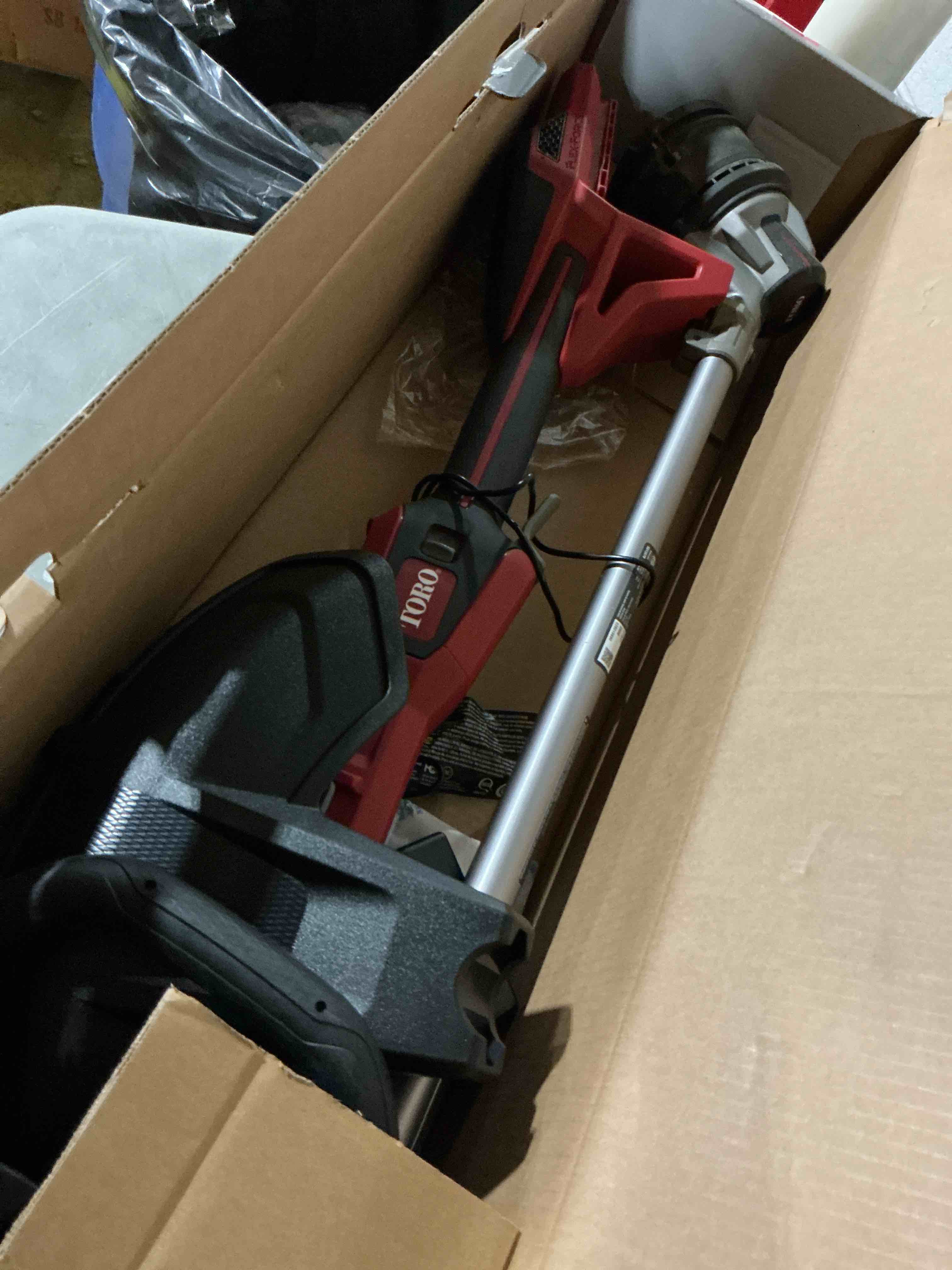 Condition photo showing As Is for toro 51837 16 in. 60 v battery string trimmer kit (battery & charger)