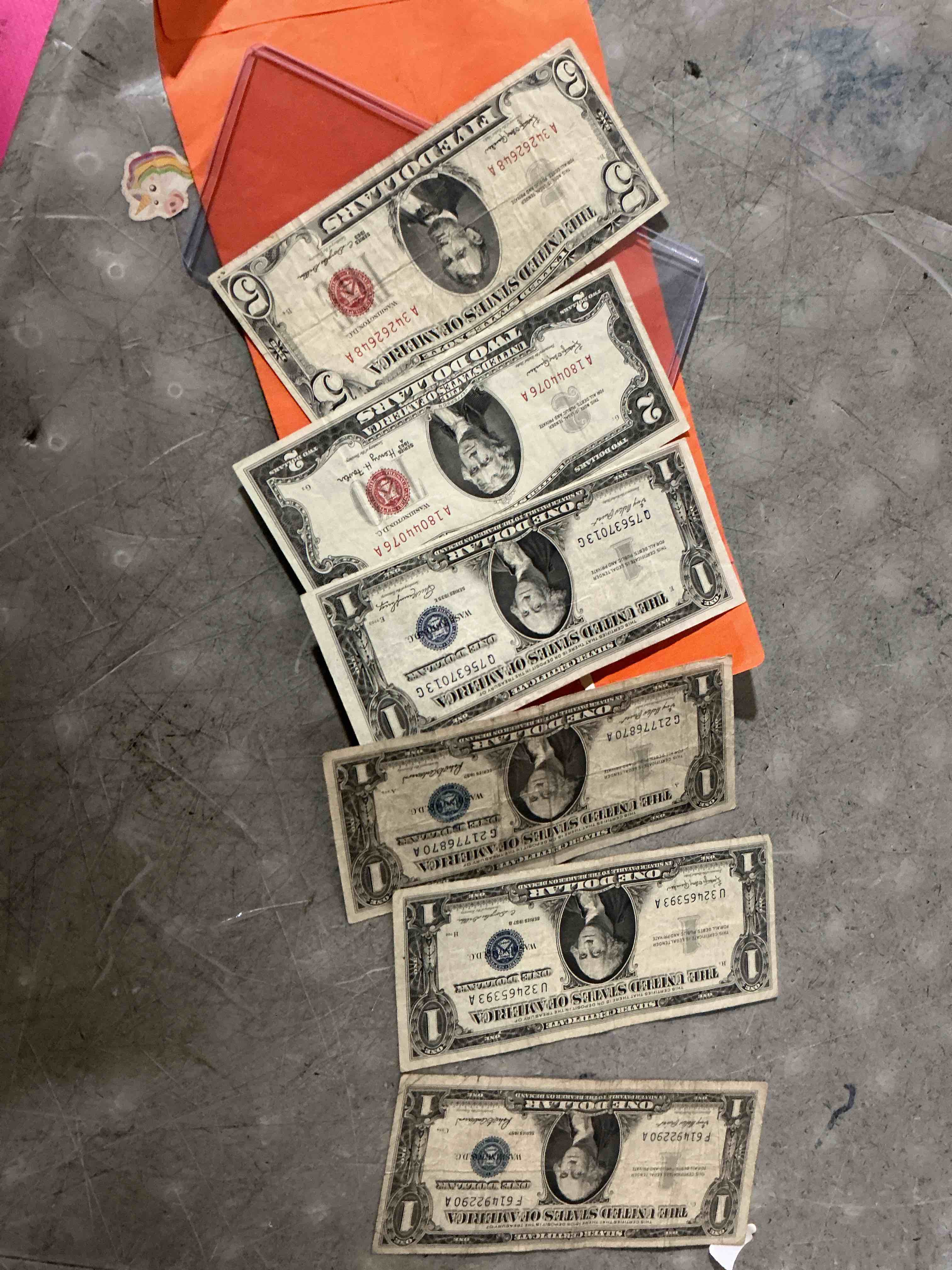 Condition photo showing As Is for rare american dollar bills! red seal five dollar bill & red seal two dollar bill, along with silver certificates! five dollar bill ultra rare & in good condition, red seal two dollar bill in good condition & silver certificates produced from 1878 to 1964 & are still considered legal tender at face value. here are gorgeous, circulated 1935 & 1957 u.s. one dollar silver certificate, with highly collectible "blue seal!* own an awesome piece of history! american dollar lot!