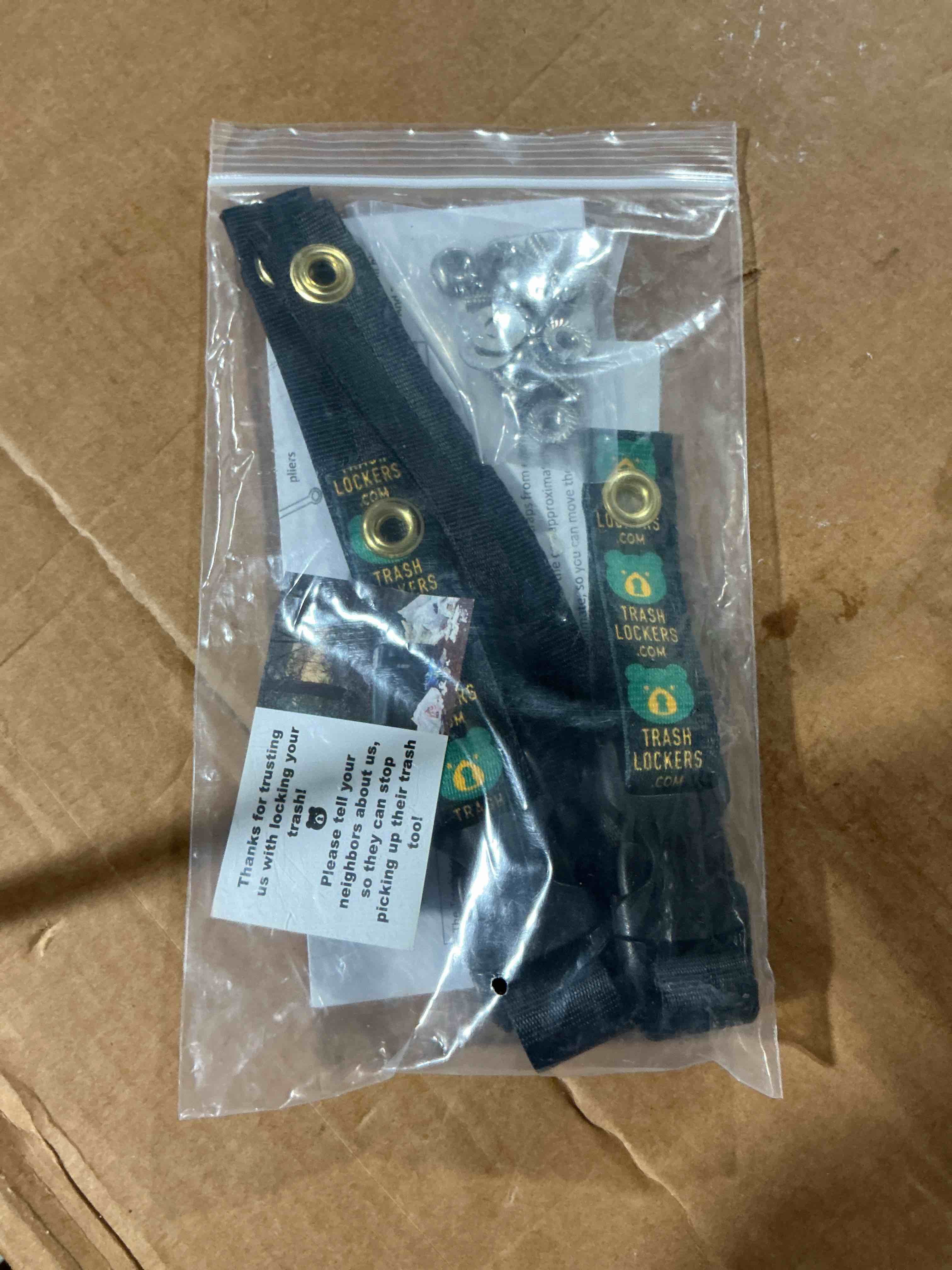 Condition photo showing Brand New for trash lock original two strap lid lock, very secure, deter black bears, keep raccoons, and squirrels out of your trash (black, original two strap), patent pending design black - original two strap