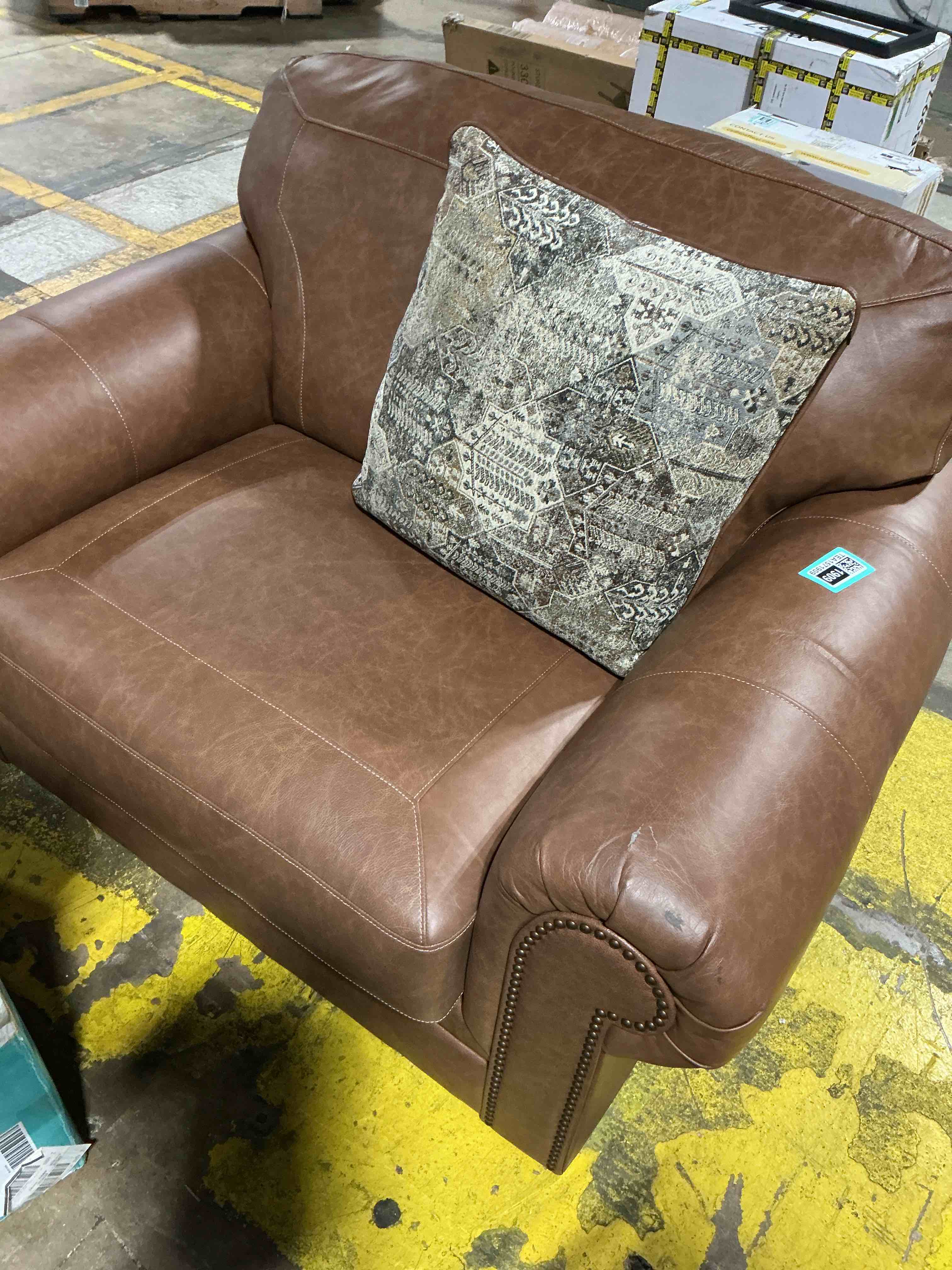 Condition photo showing As Is for signature design by ashley carianna brown leather match chair and a half with removable cushions and nailhead trim