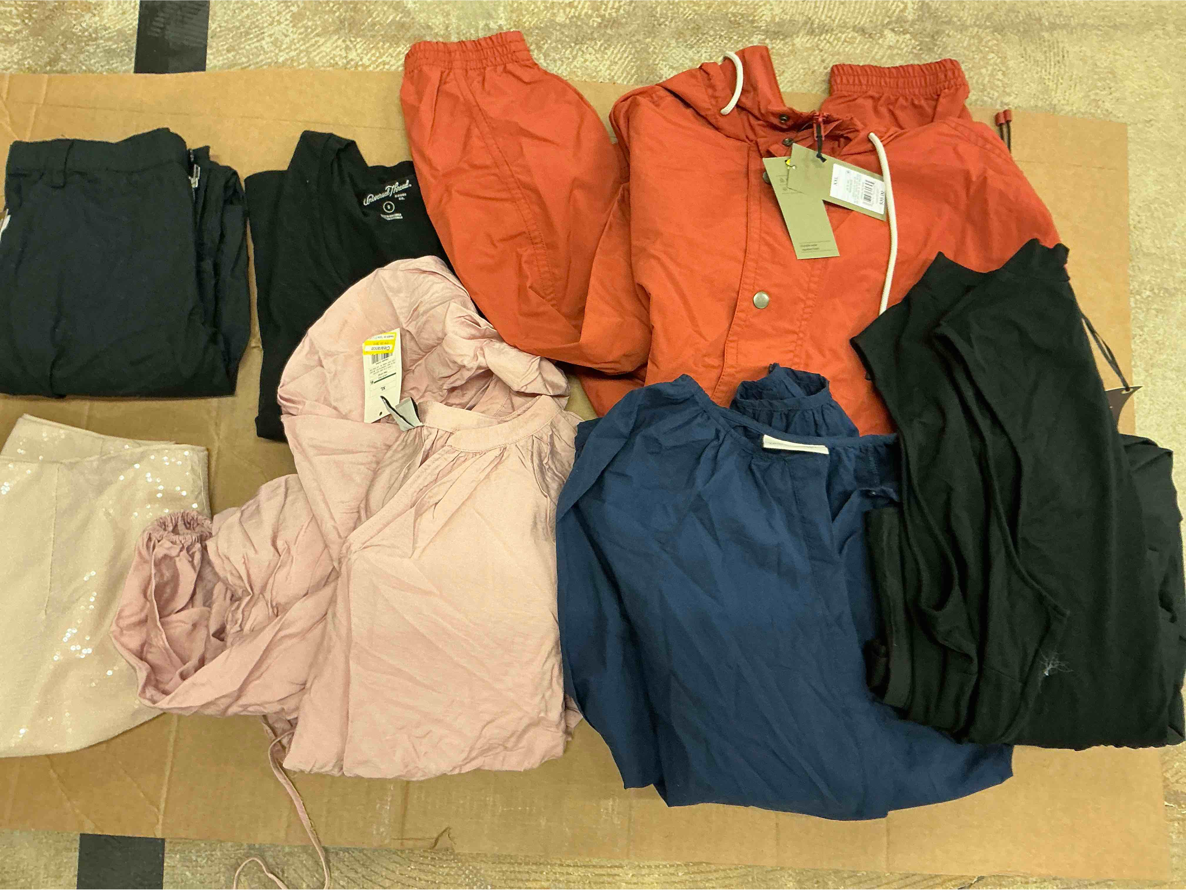 Assortment of winter and summer clothes of different size and style (30 pieces)