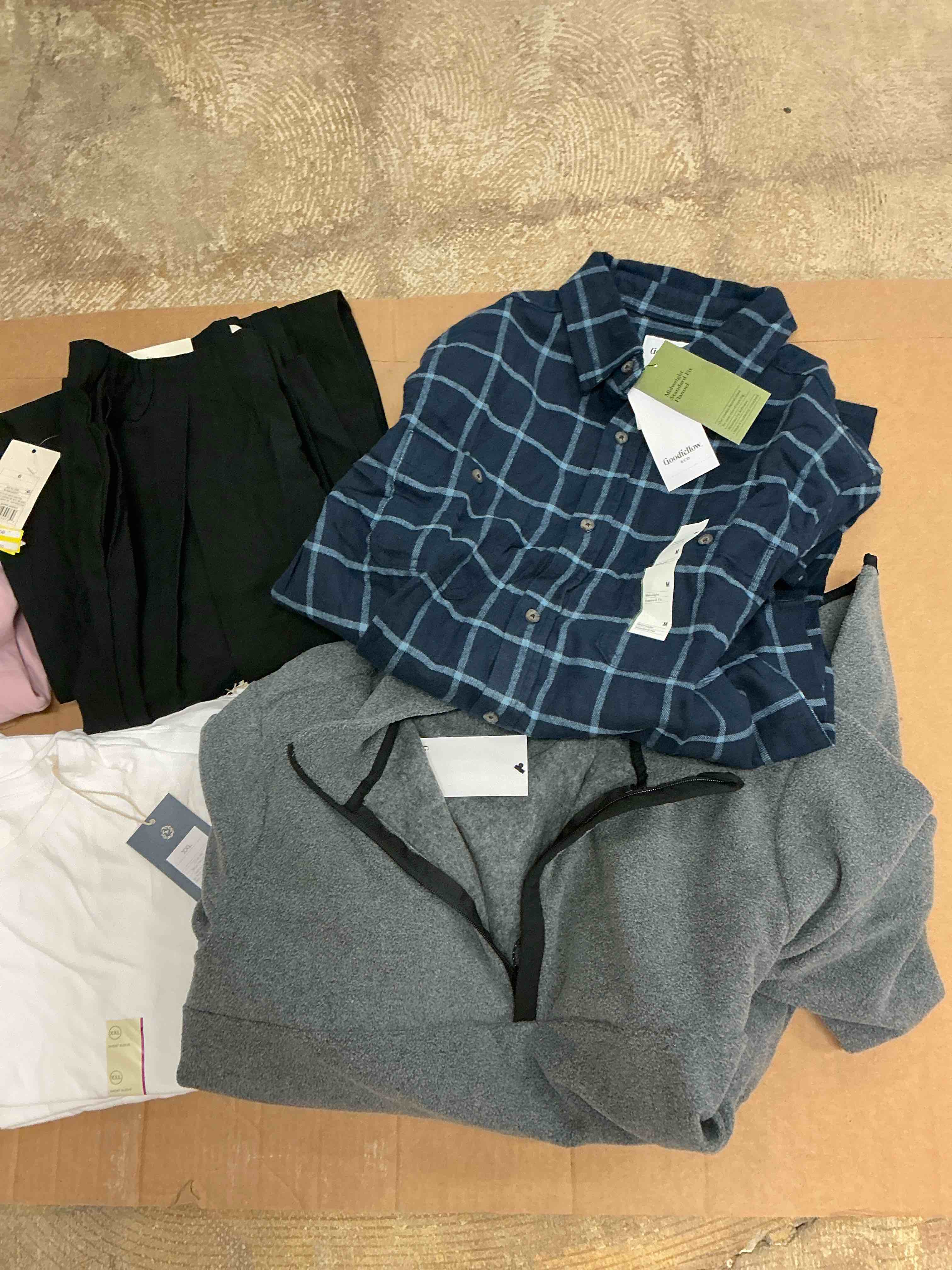 Assortment of winter and summer clothes of different size and style (30 pieces)