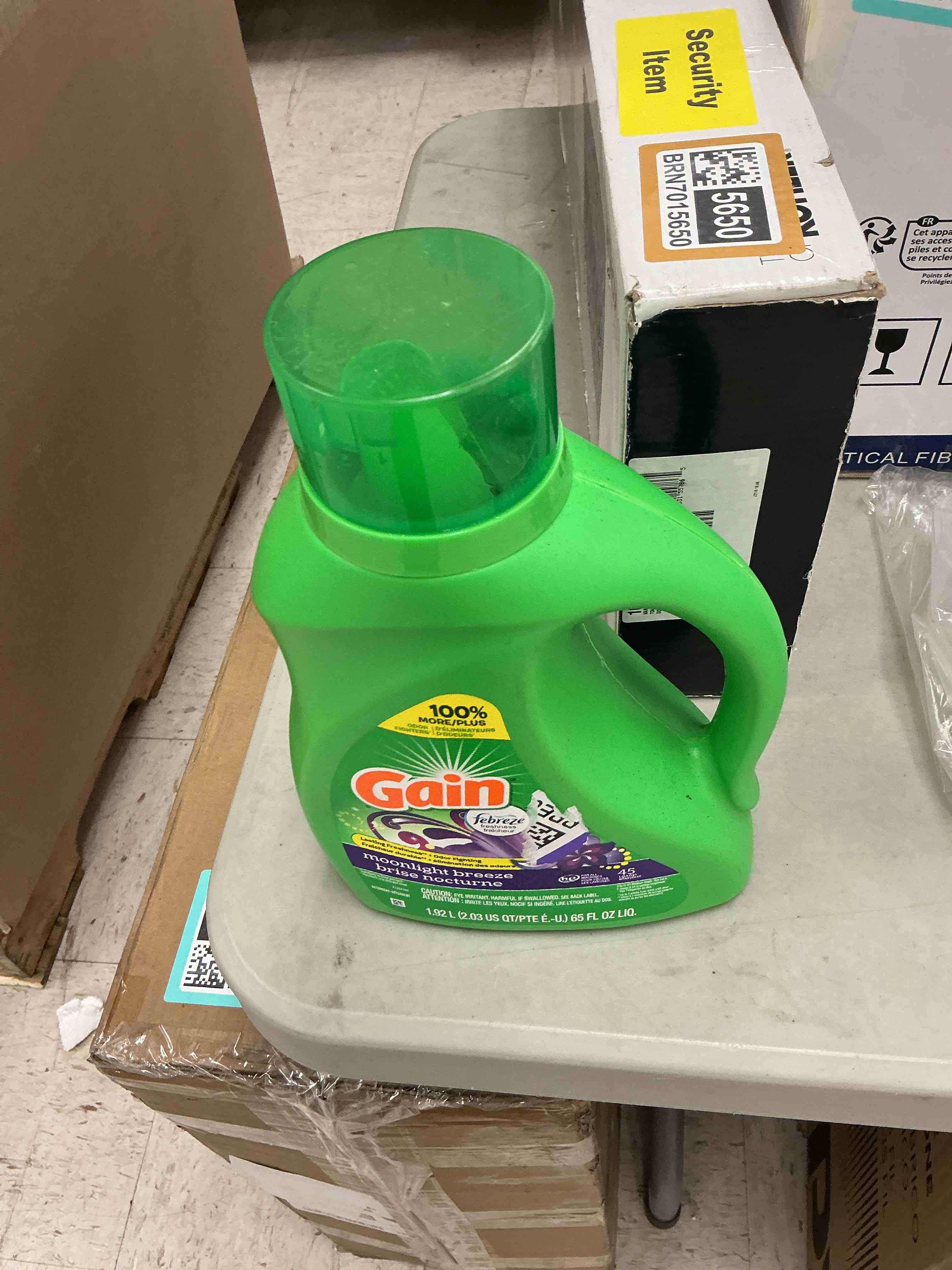 Condition photo showing New/Like New for gain, laundry detergent moonlight breeze + aroma boost, 65 fl oz