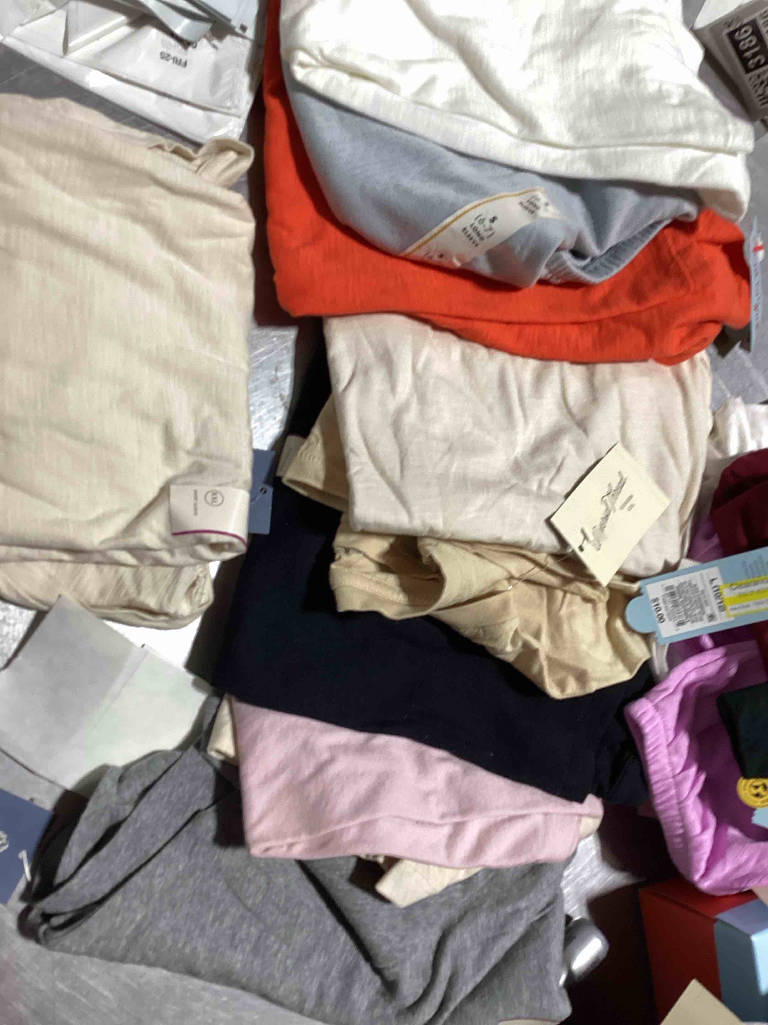 Assorted lot of various clothing such as shorts,pants,skirts and shirts,tank tops and so much…