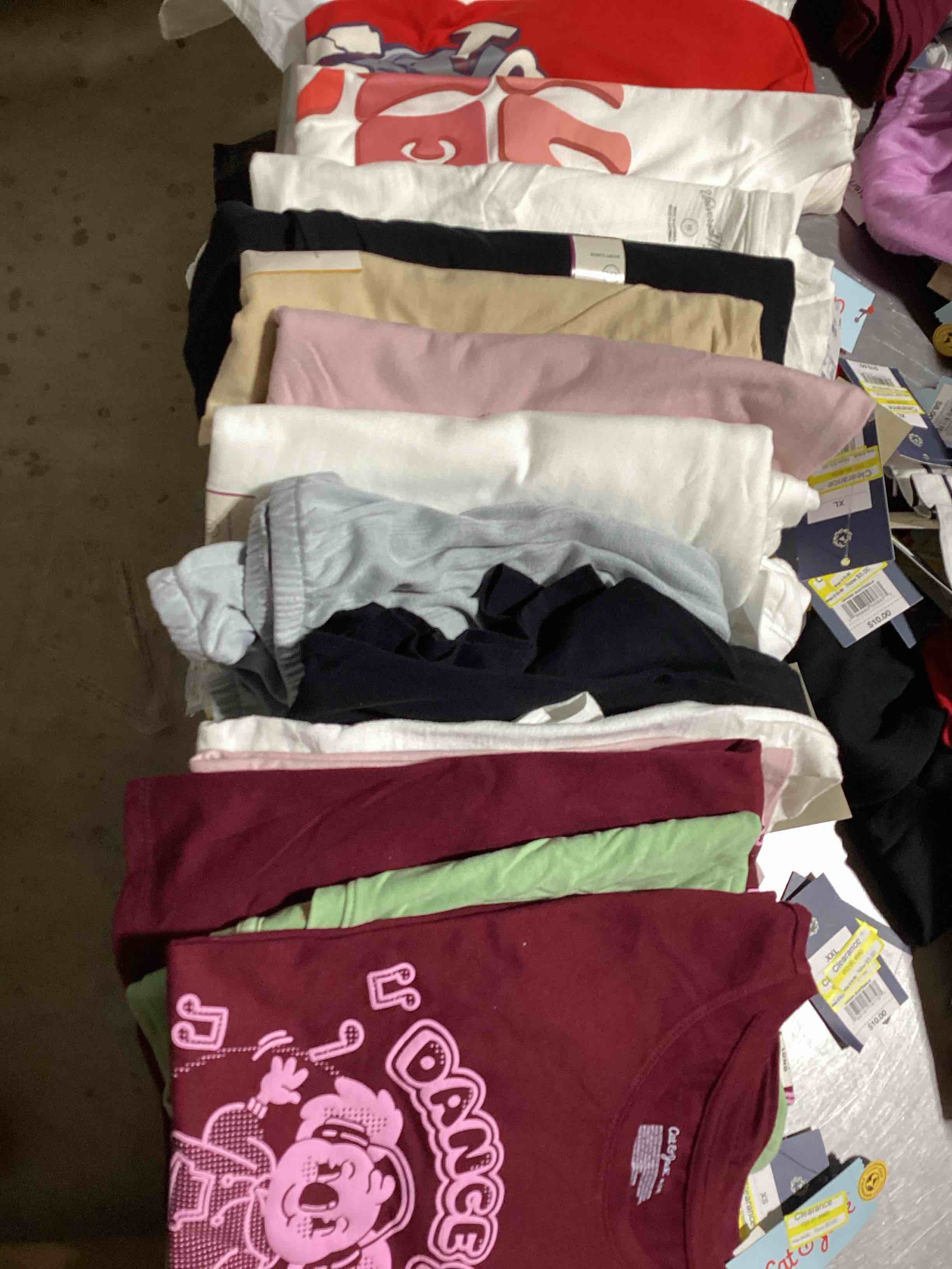 Assorted lot of various clothing such as shorts,pants,skirts and shirts,tank tops and so much…