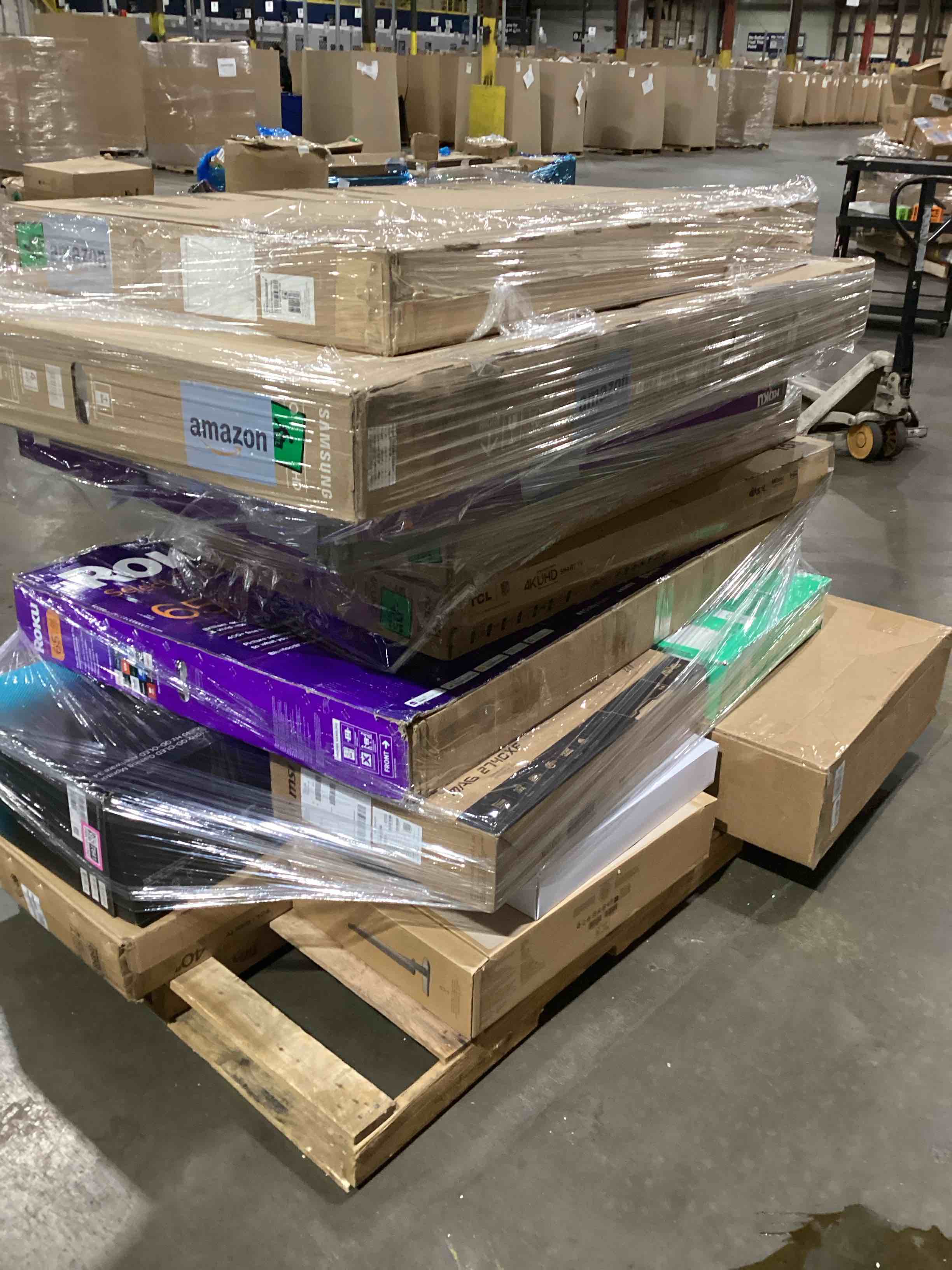 pallet of broken tv and monitors 