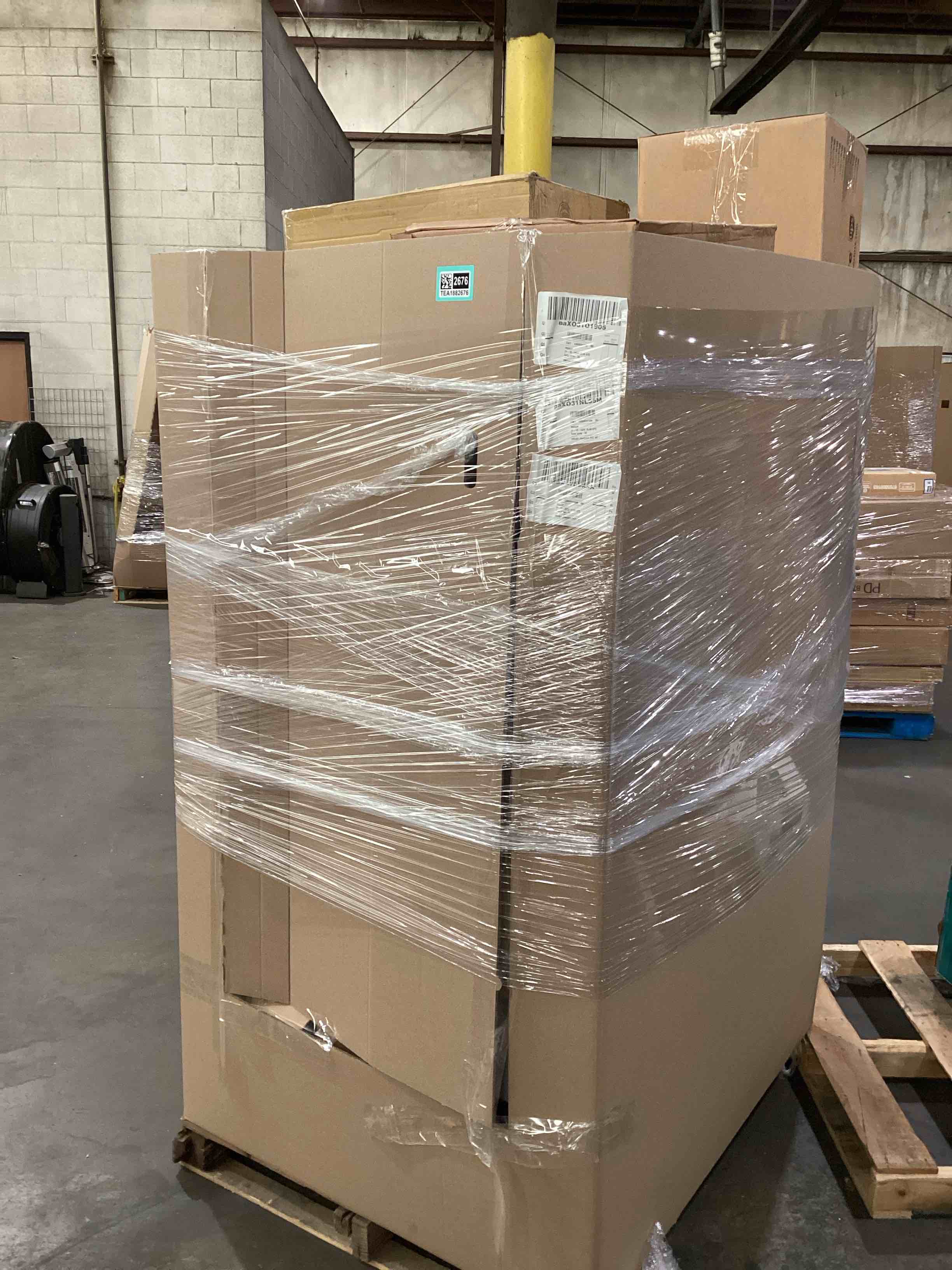 pallet of damaged assorted appliances